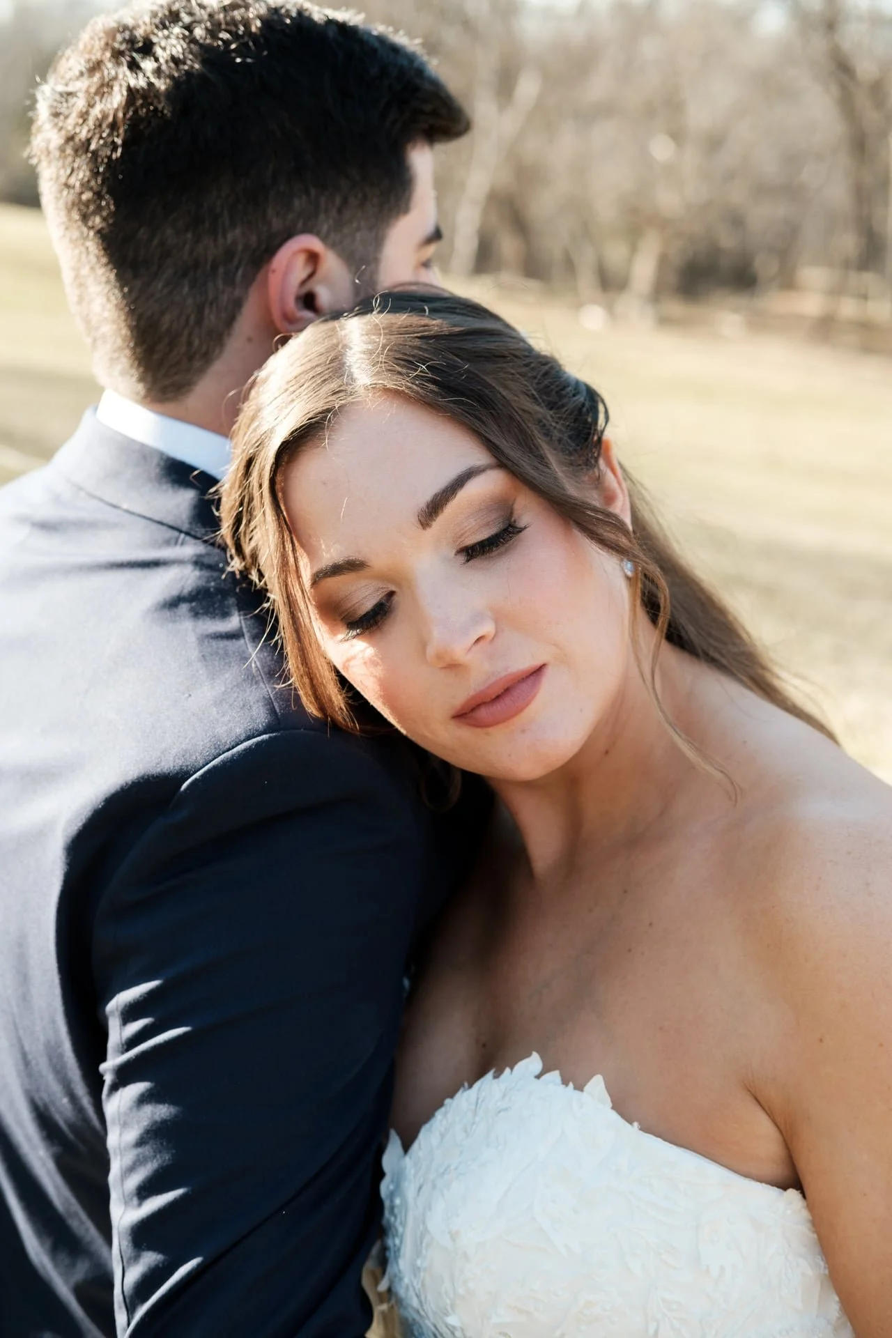 bride hugging groom after wedding ceremony at Founders Dairy Barn