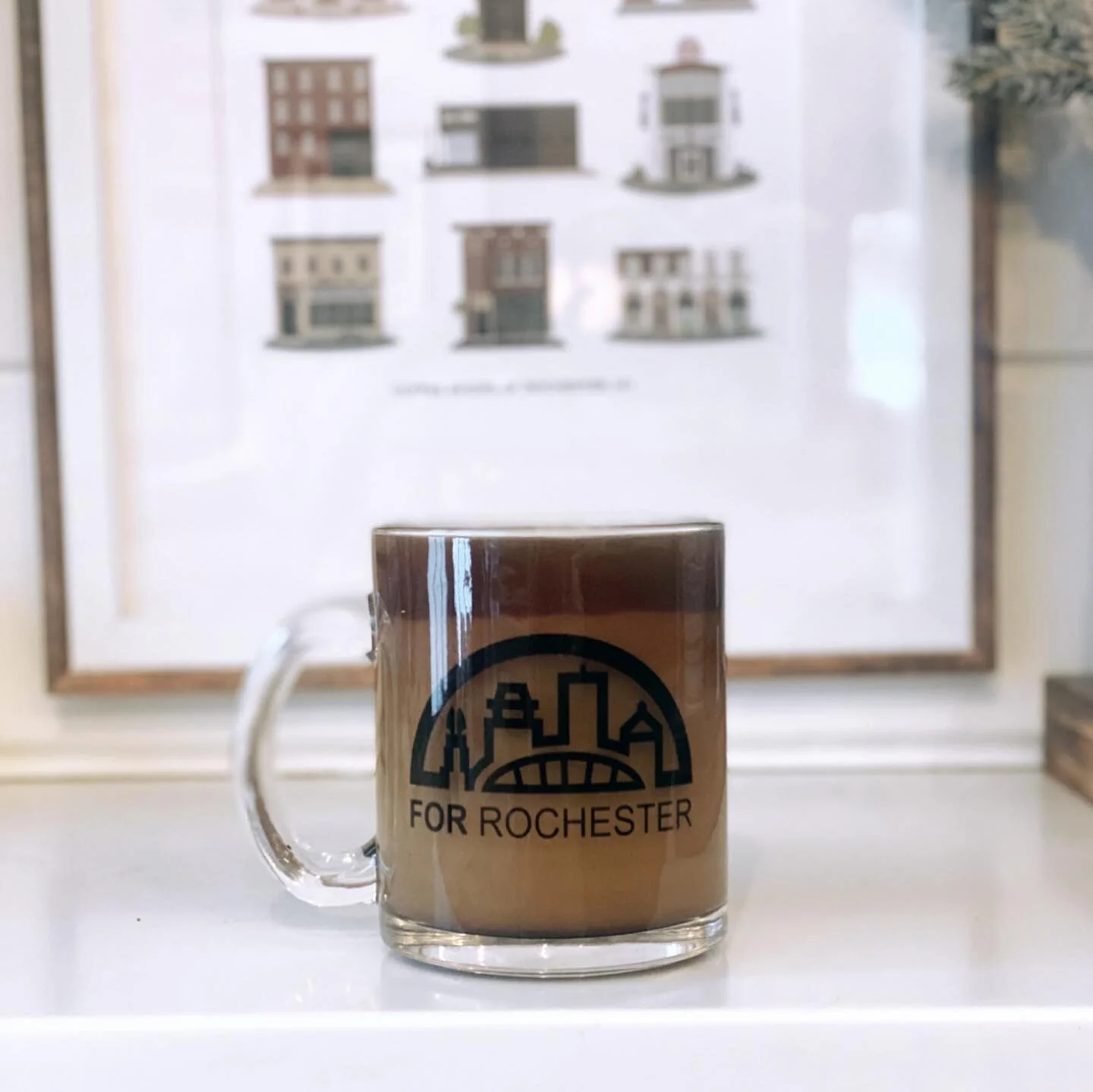 ☕️ Start the day right! Two new mugs with the fresh For Rochester design are now available in the shop! Both feature a double-sided design and are 10 oz. The glass one is a gorgeous addition to your home collection, and the travel mug with lid and st