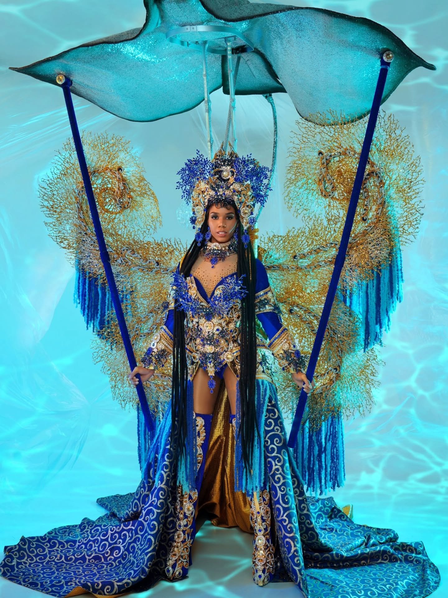 Yemaya &mdash; Deity of the Ocean 🌊✨

Miss Universe Cayman Islands National Costume by Patrick Isorena @patrick_isorena 

My national costume is a living tribute to the Cayman Islands coral reefs. Dressed in the crystal blues of home, every shimmer 