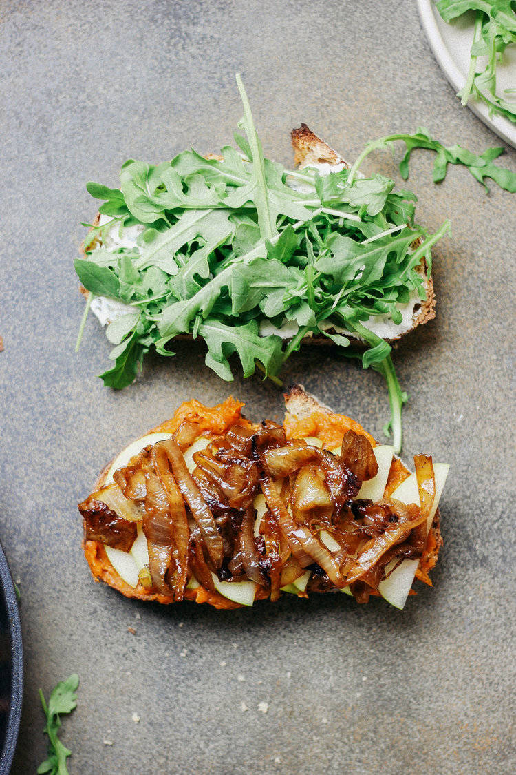 Savory Herbed Sweet Potato Sandwiches with Caramelized Onion, Green Apple, and Arugula