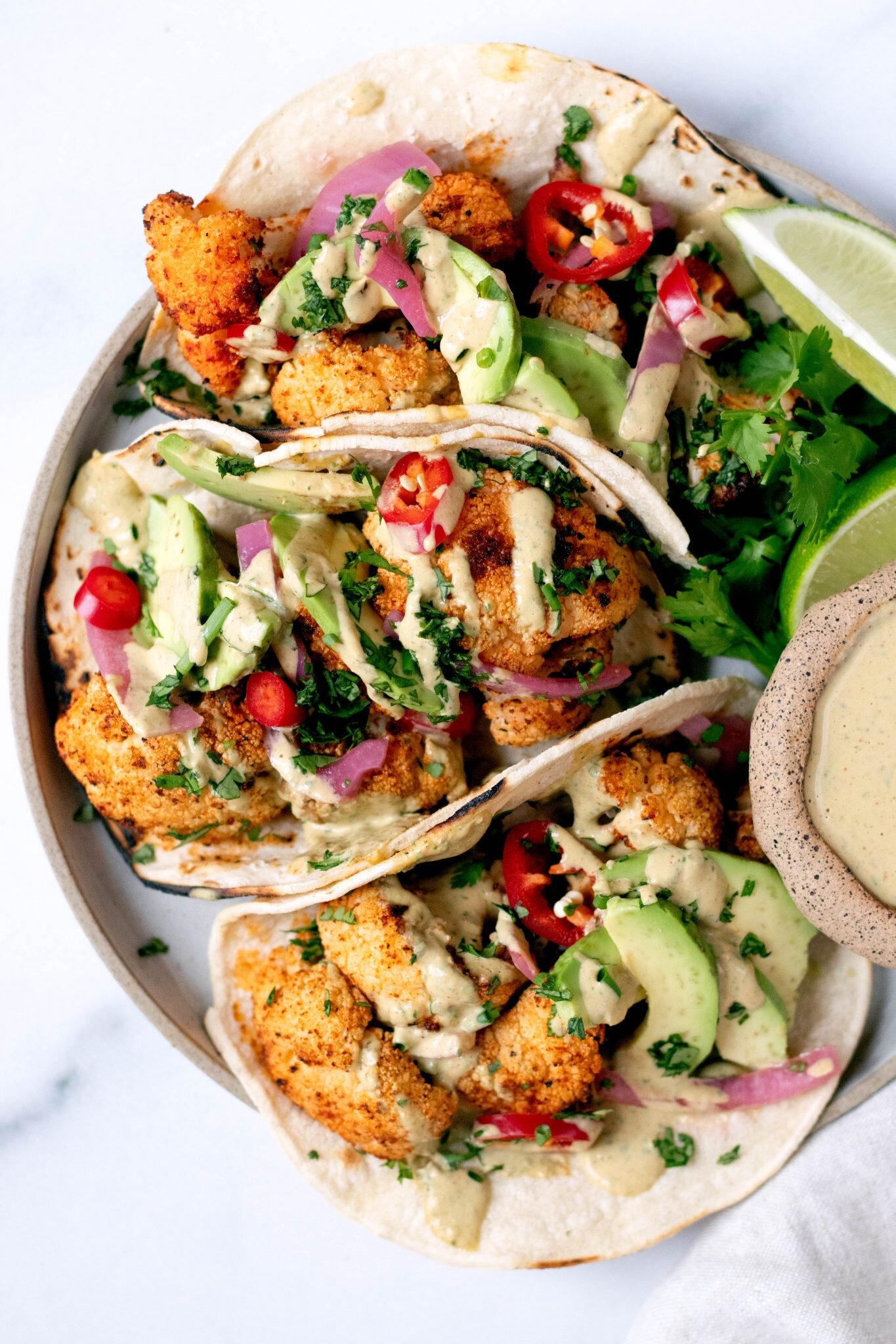 Roasted Cauliflower Tacos with Cilantro Lime Tahini Sauce