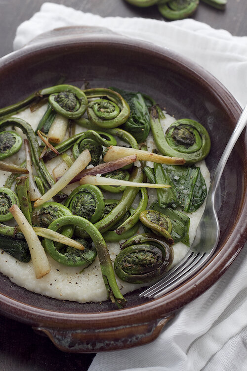 Cheese Grits with Fiddleheads and Ramps in Brown Butter