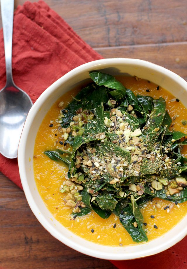 Carrot soup with tangled collard greens and dukkah