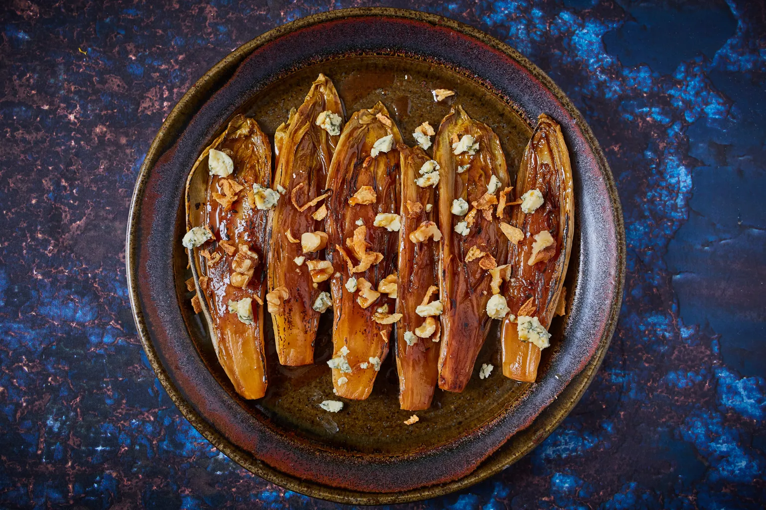 Caramelised chicory with orange, blue cheese and walnuts