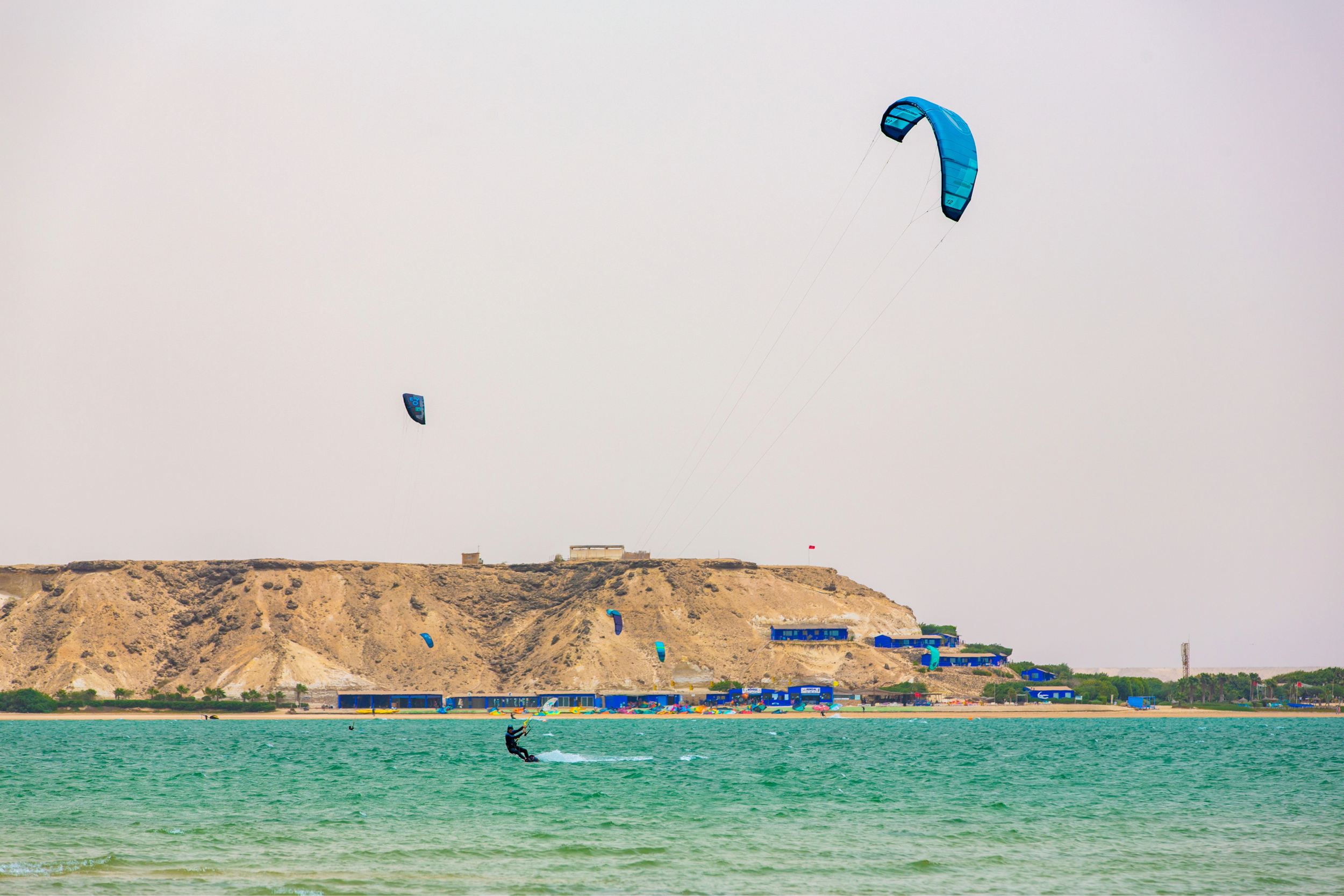 Kite surfer riding waves on the coast of Morocco