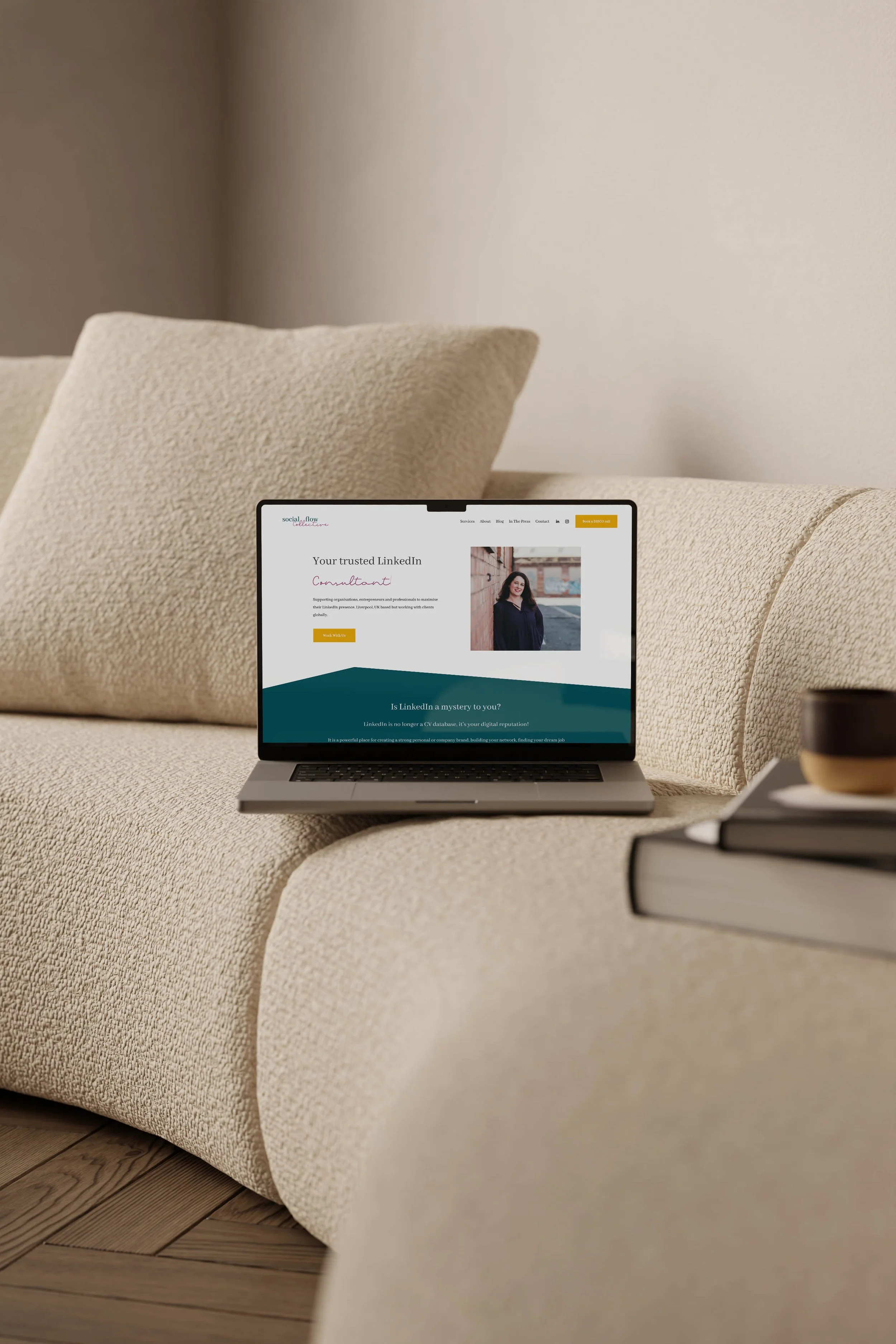 A laptop mock up of a website ruth designed on Squarespace for Laura from Social Flow Creative