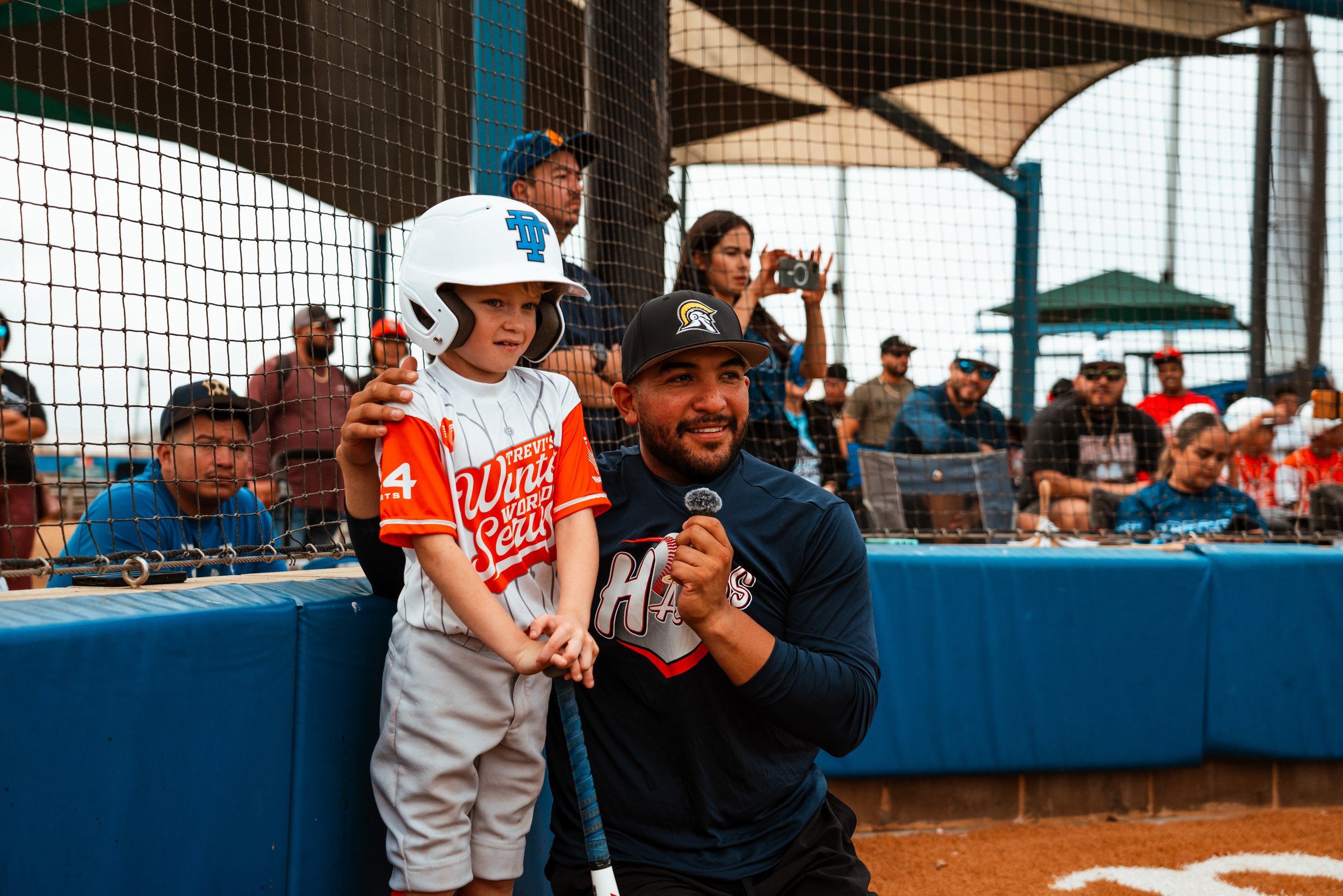 Jose Trevino poses with a youth baseball player in Portland, Texas during his Winter World Series Tournament. Photo by Sarate Baseball Media.