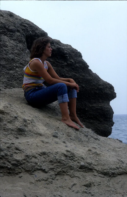 Julia Dean sits near the lake in Rochester, New York during her time as a photography student at Rochester Institute of Technology (RIT). 