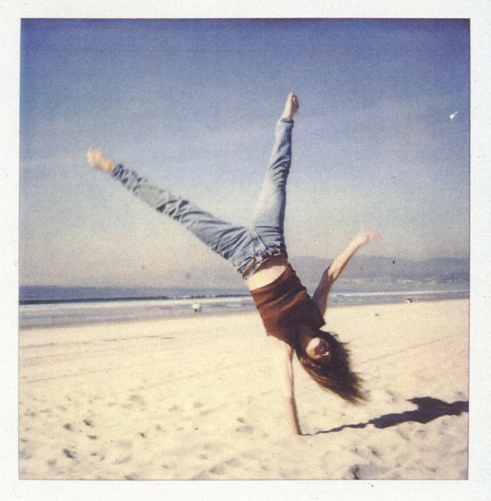 Julia Dean does a cartwheel on Venice Beach in 1994, the year she moved to Los Angeles.