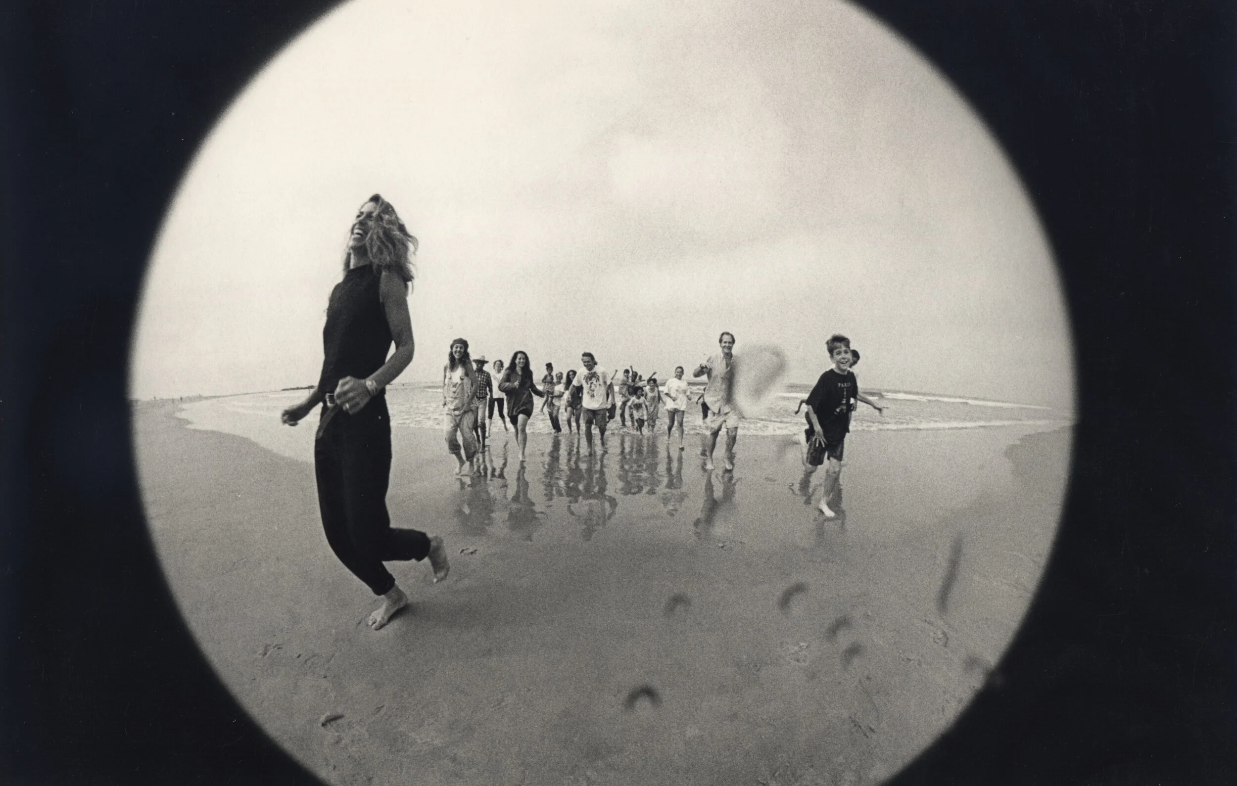 Julia Dean leads children, parents, and teachers during a fun photo shoot on Venice Beach in 1994. Julia was a volunteer for the Venice Arts program at the time.