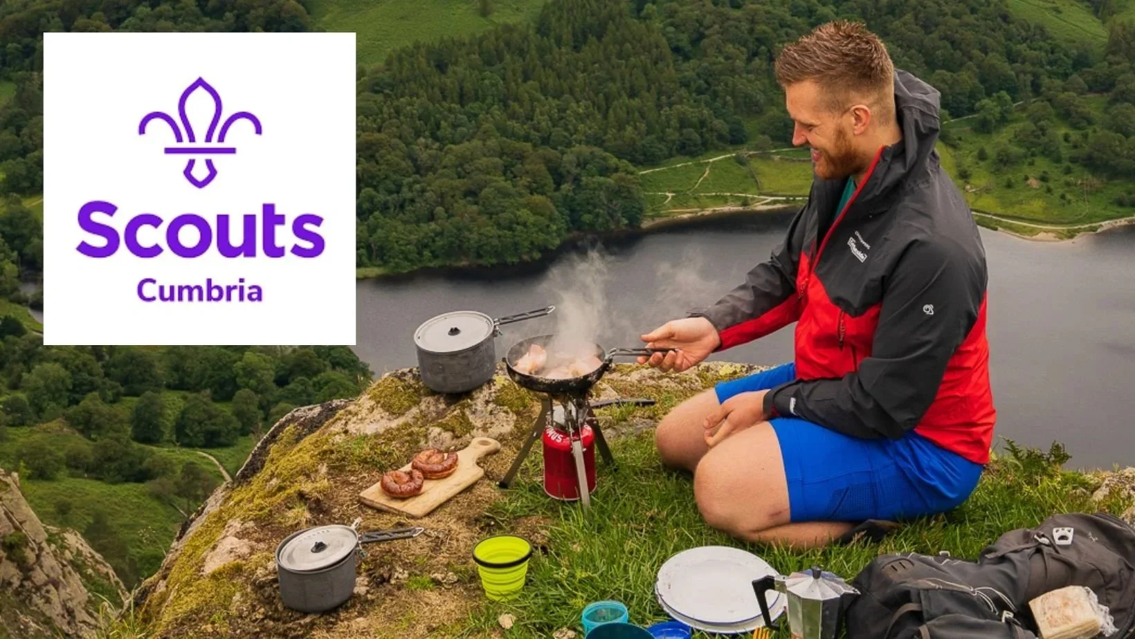 Photograph of Fell Foodie cooking on Nab Scar in the Lake District with the logo for Cumbria Scouts overlayed on top of the image