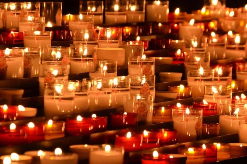 a bunch of candles that are lit