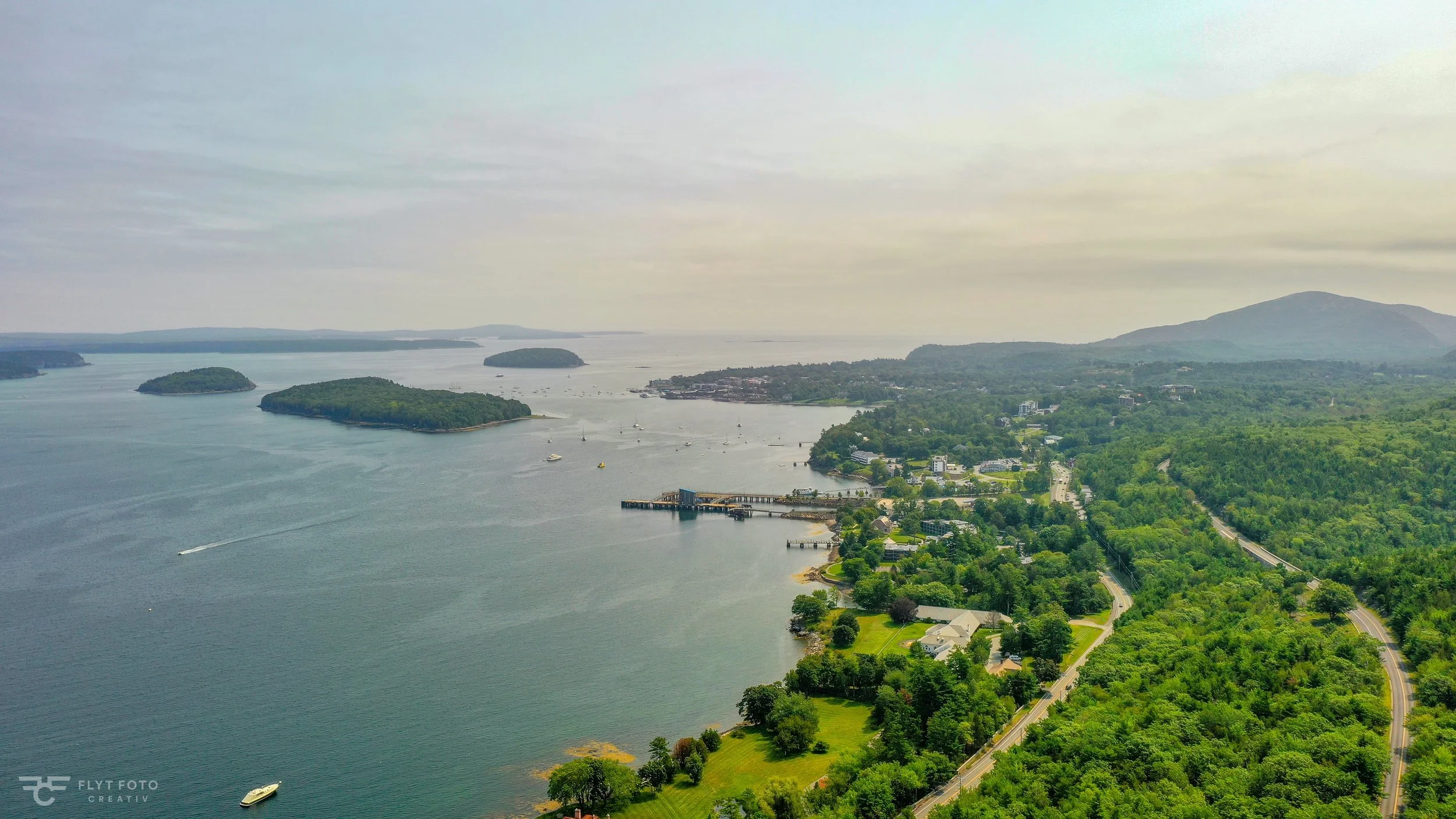 An aerial drone photo showing part of Mount Desert Island and the Atlantic Ocean