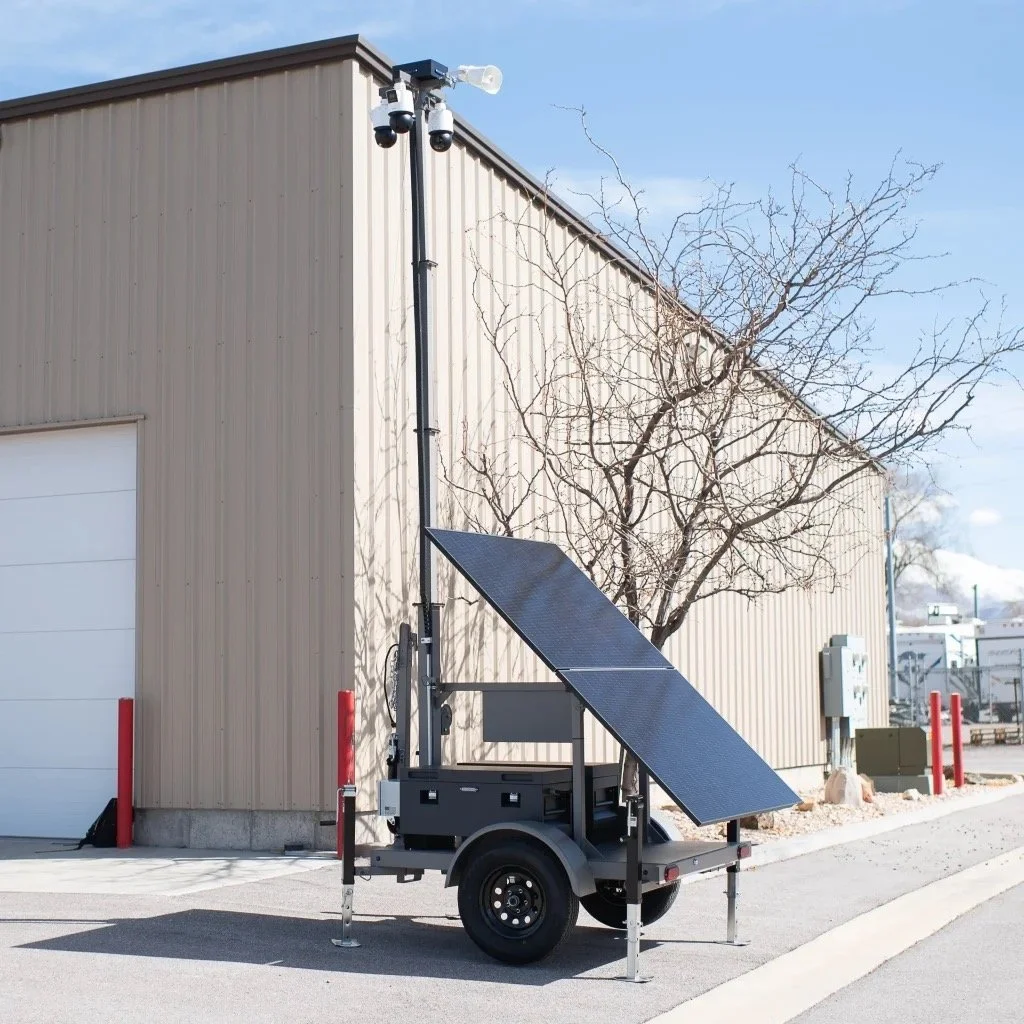 Mobile solar observation station with solar panel and cameras in an industrial area