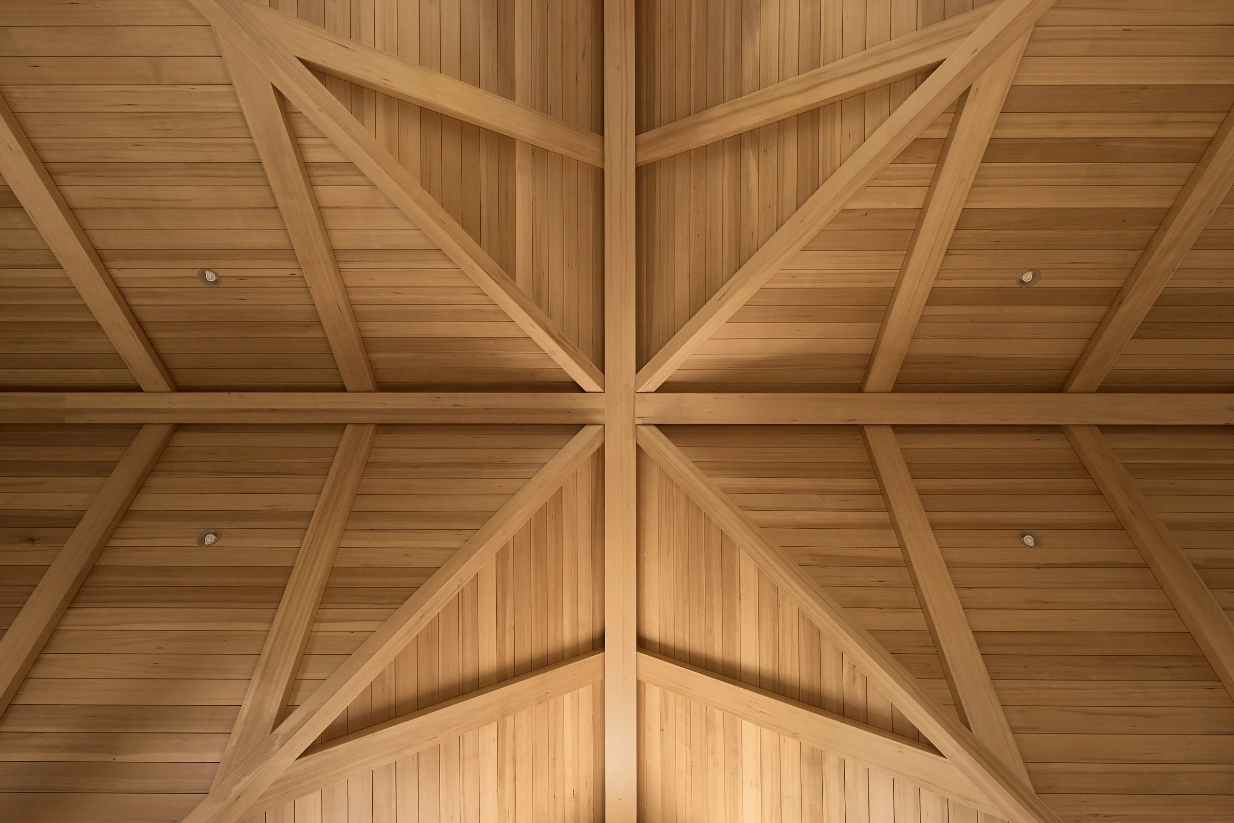 Modern farmhouse style single family residence. View of double-vaulted wood ceiling.