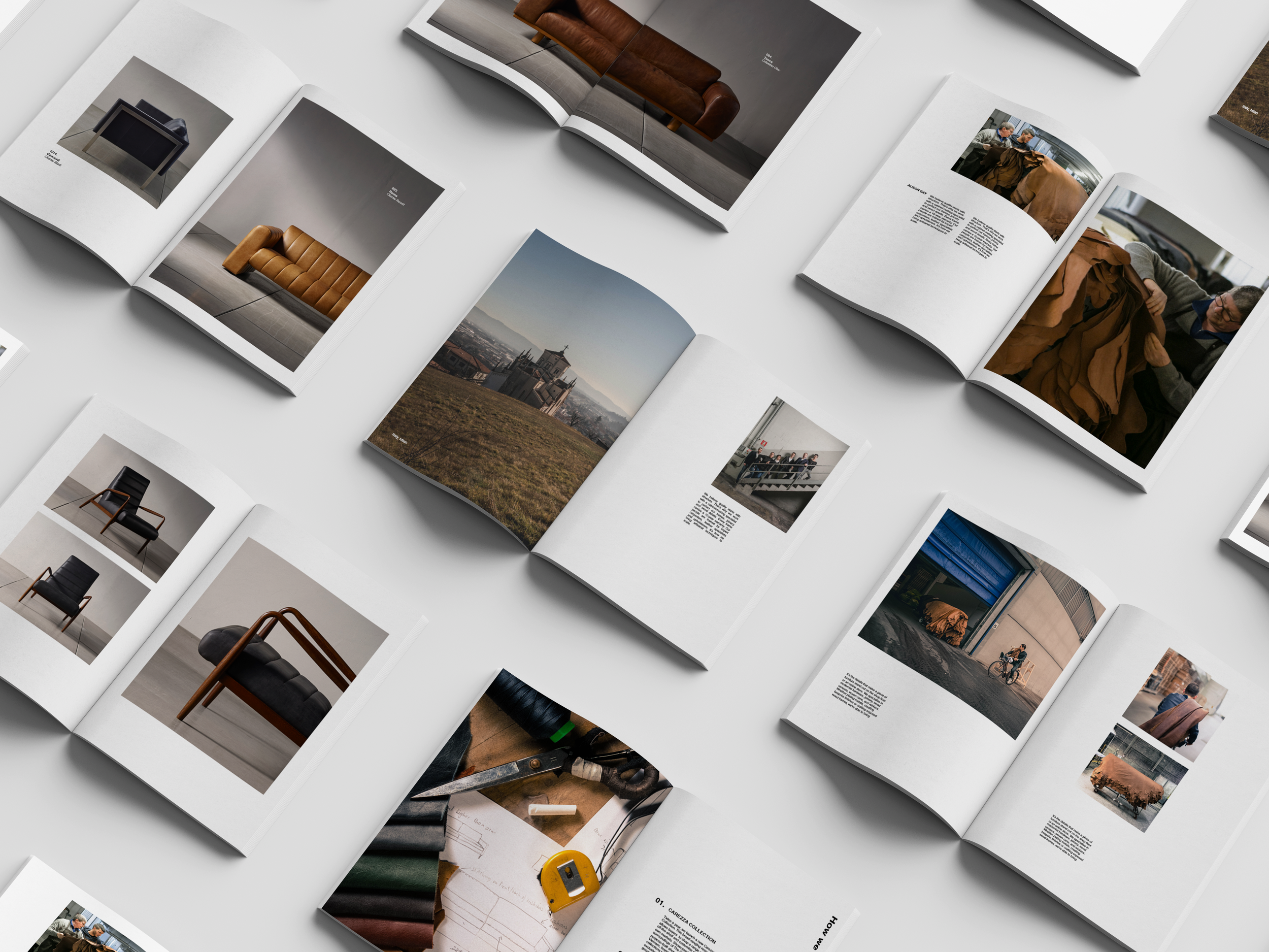 Multiple open magazines spread out on a white surface showing interior design, architecture, and craft photography and articles.