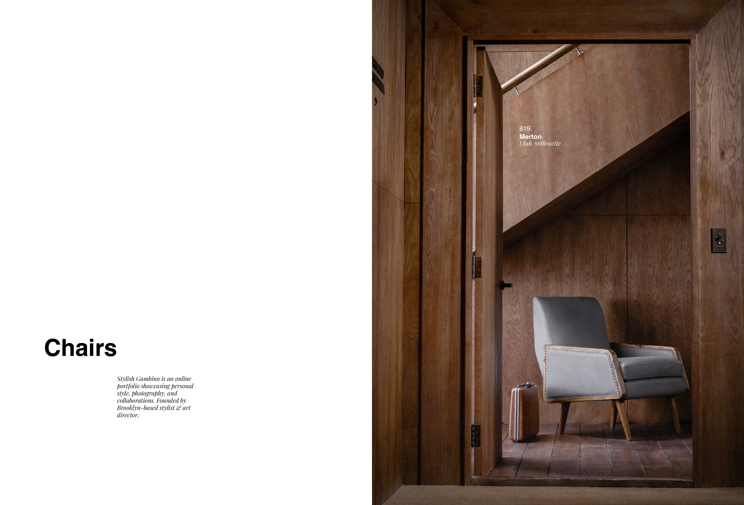 A cozy wooden-paneled waiting area with a mid-century modern armchair, a small suitcase, and a sloped ceiling in the background.