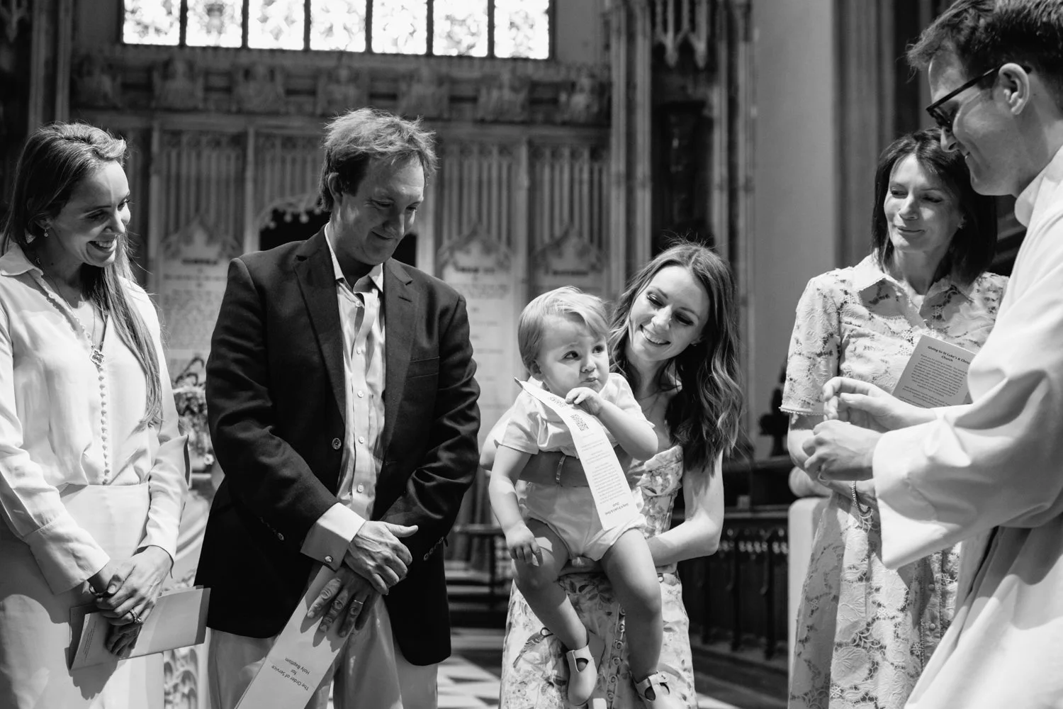 Baby boy looking susicipously at the vicar