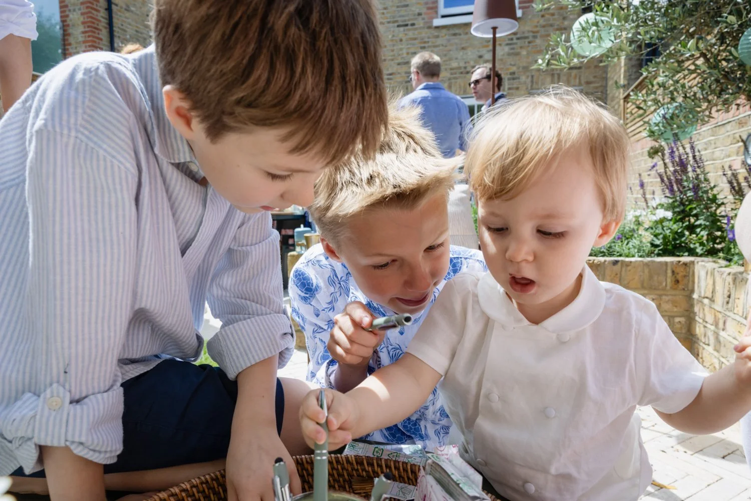Three brothers playing