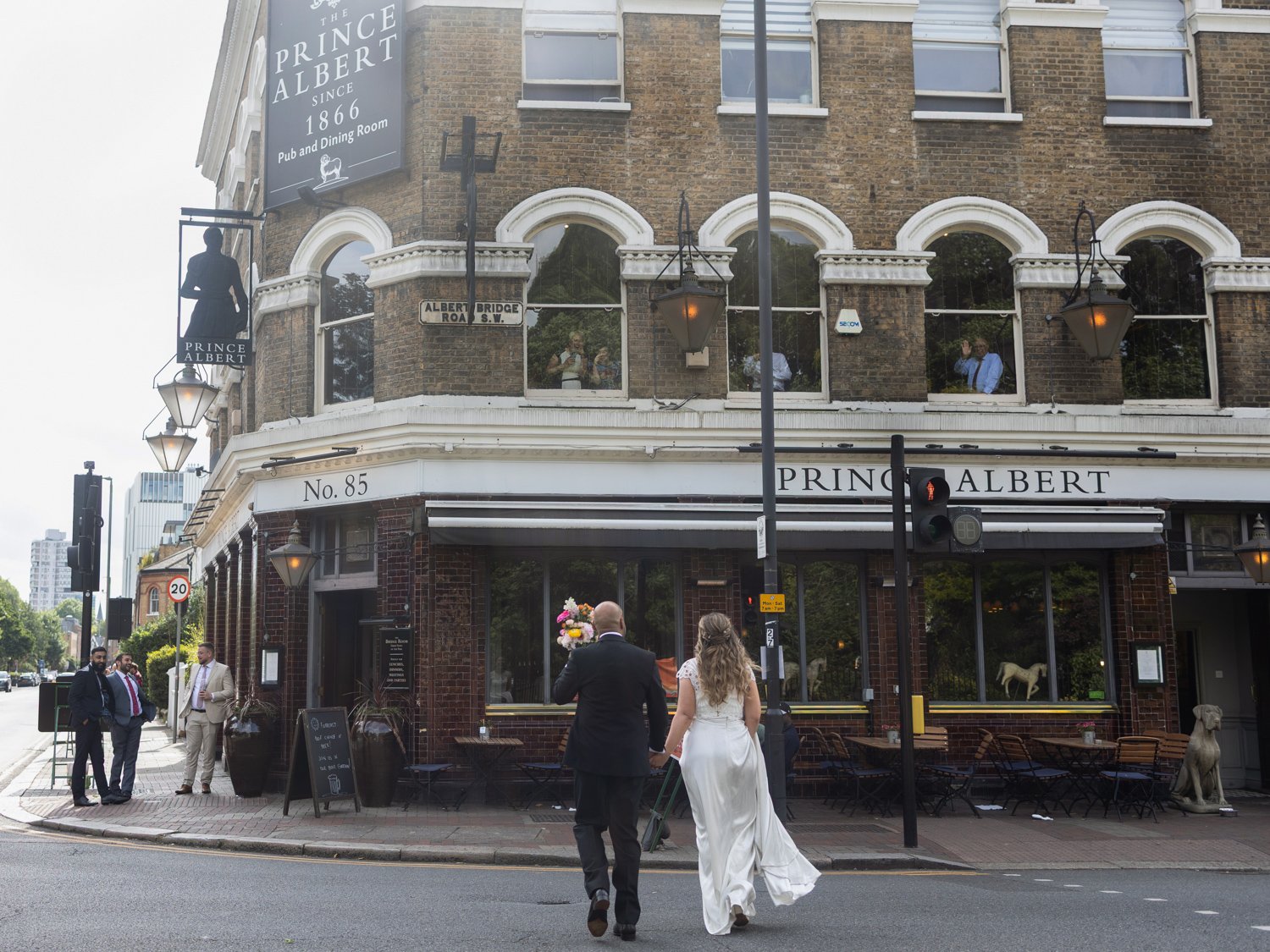 Bride and Groom walking towards the Prince Albert in Battersea