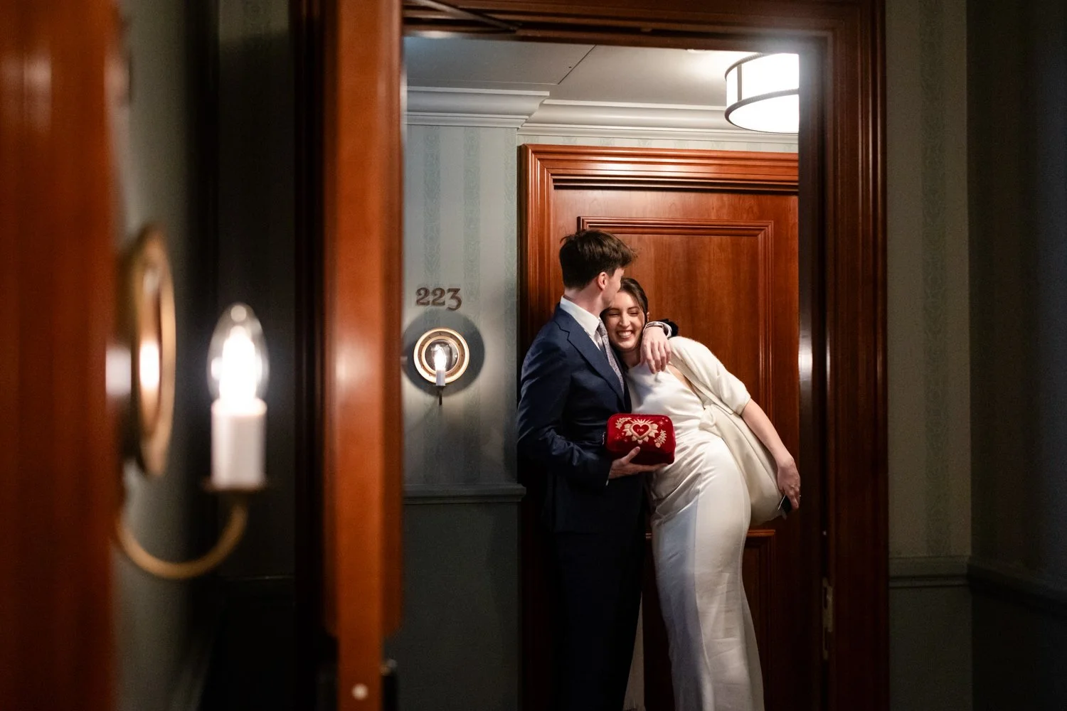 Bride and Groom leave the Ned hugging
