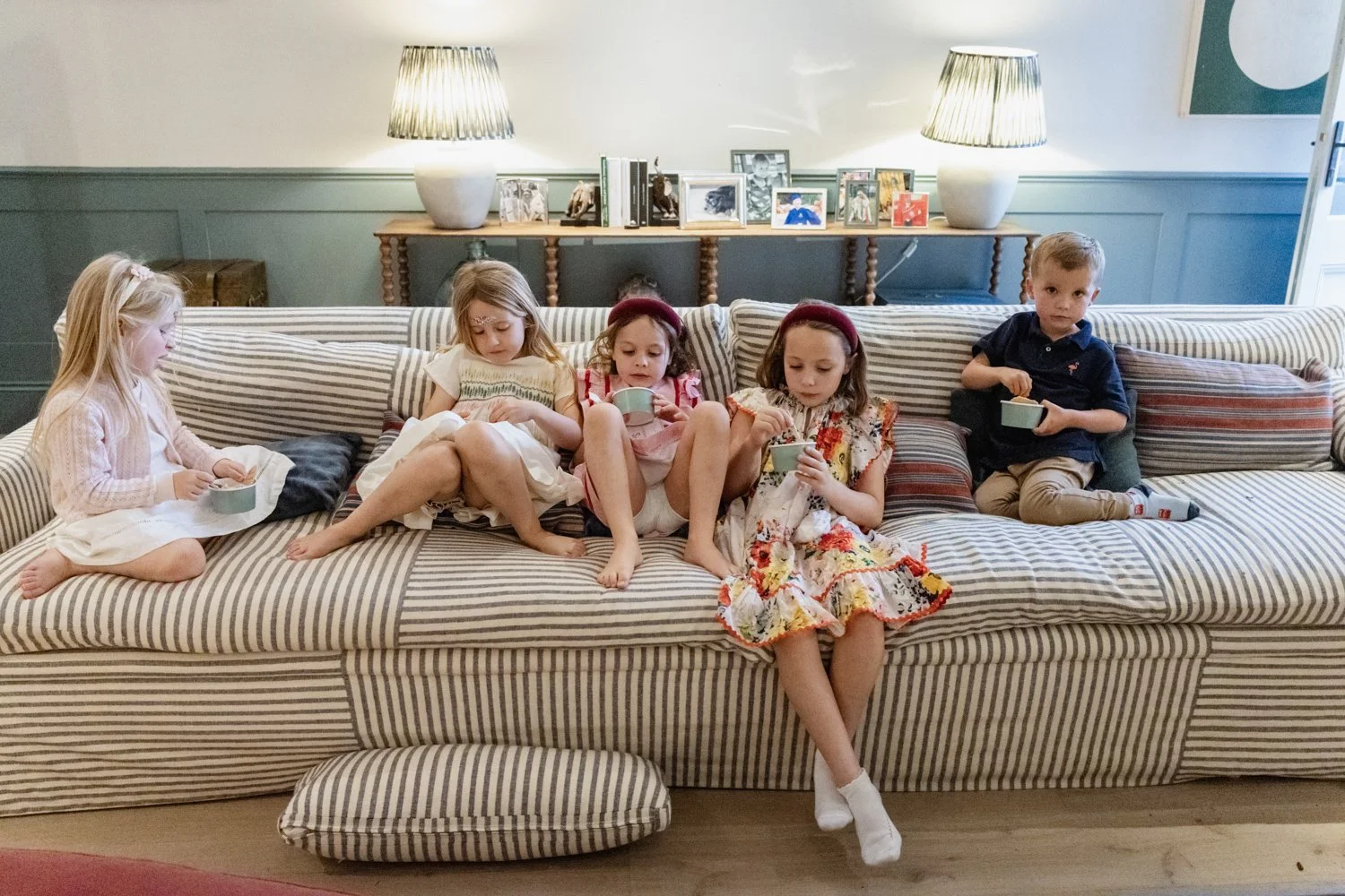 kids eating ice cream on sofa