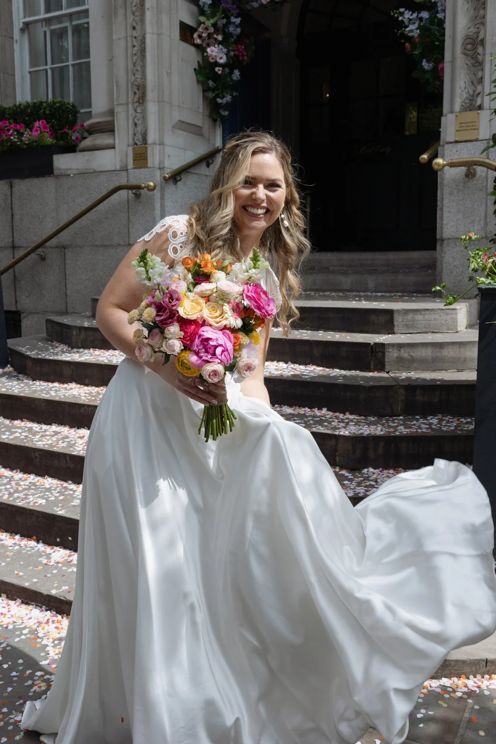 Portrait of bride on the steps of Old Chelsea Town Hall.