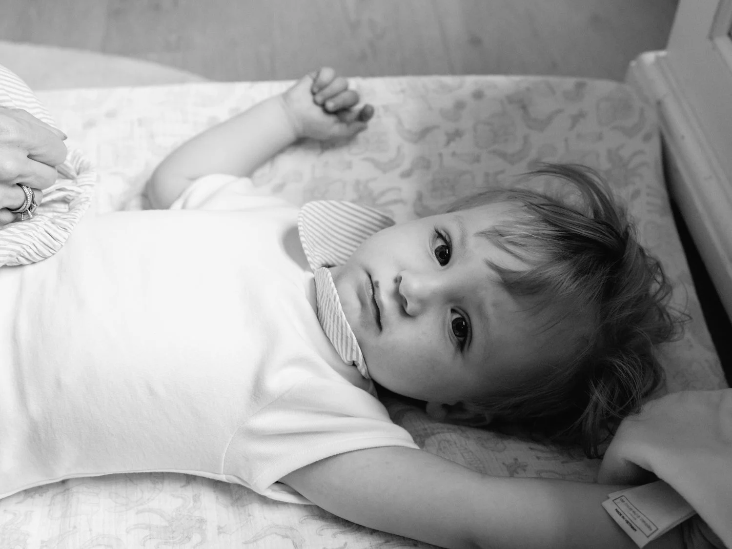 aerial view of baby boy on the changing mat.