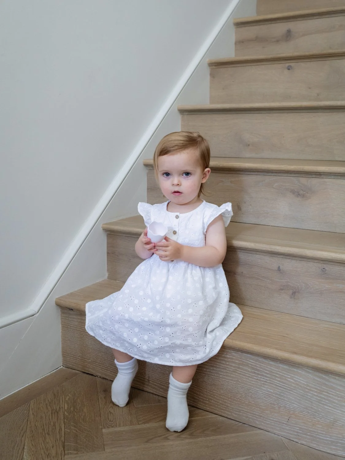 portrait of little girl on stairs