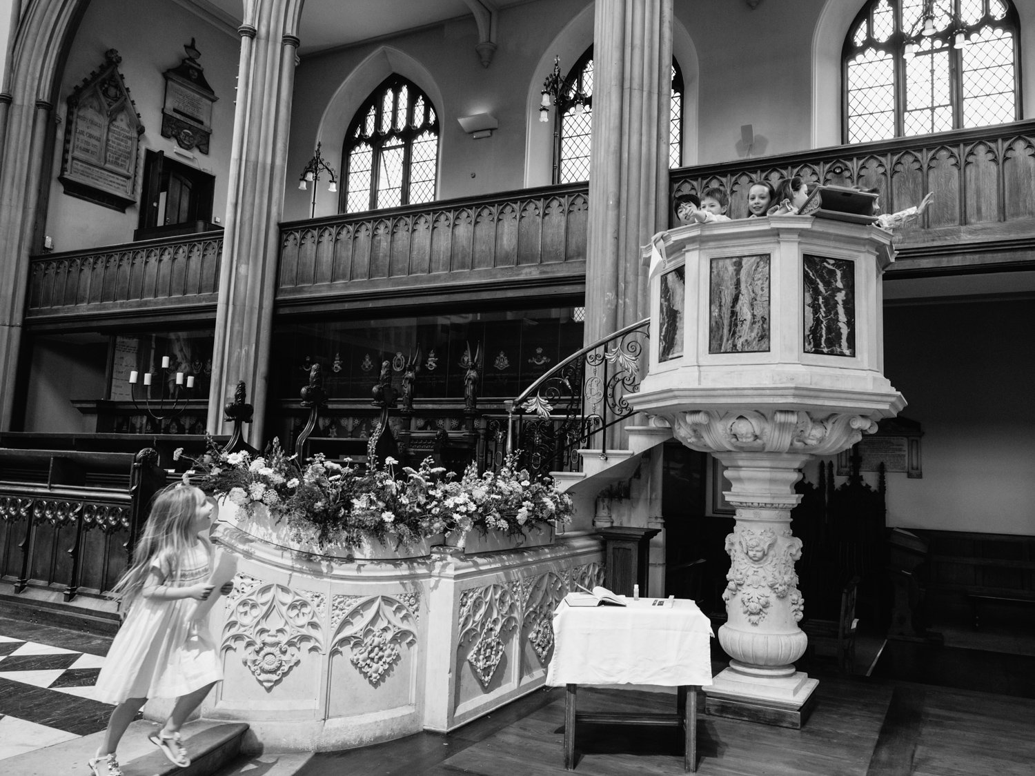 children playing and rehersing their lines in the pulpit.