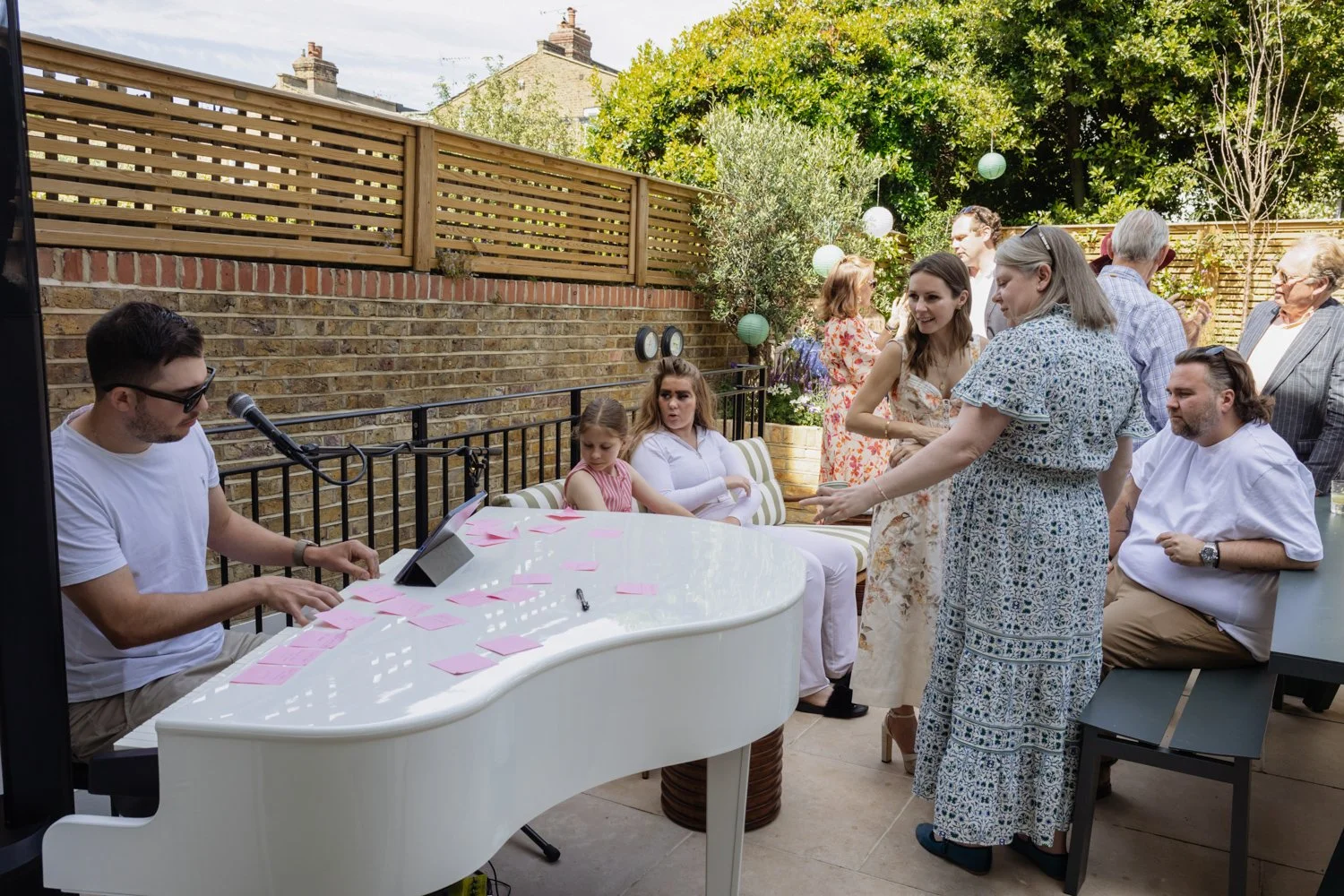 Christening reception with grand piano in the garden with pianist
