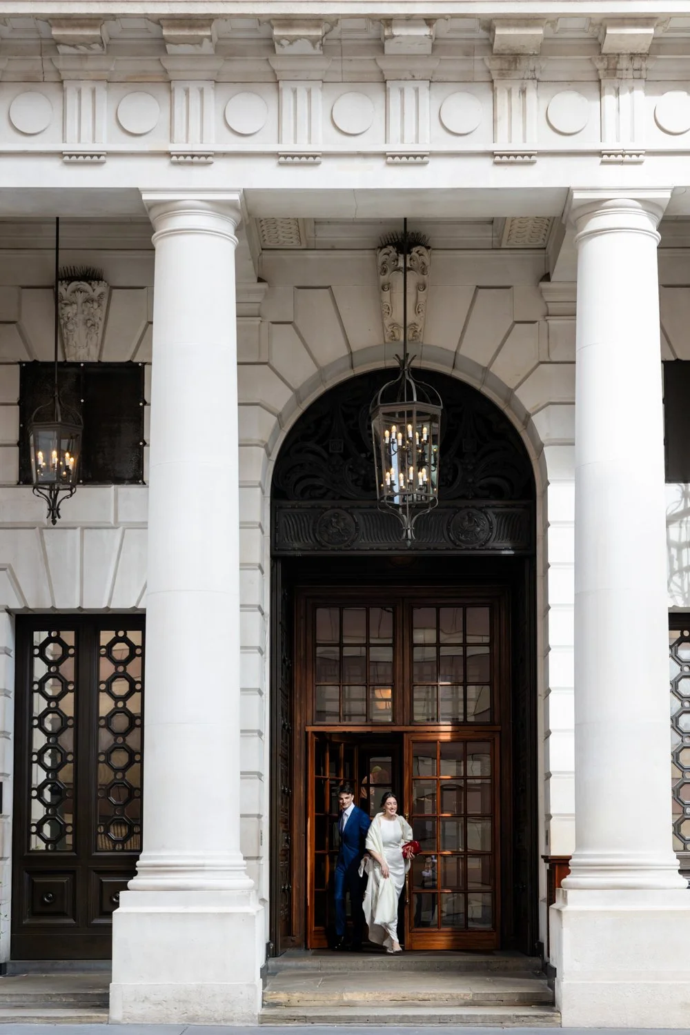 Bride and groom making their exit of the Ned in the City
