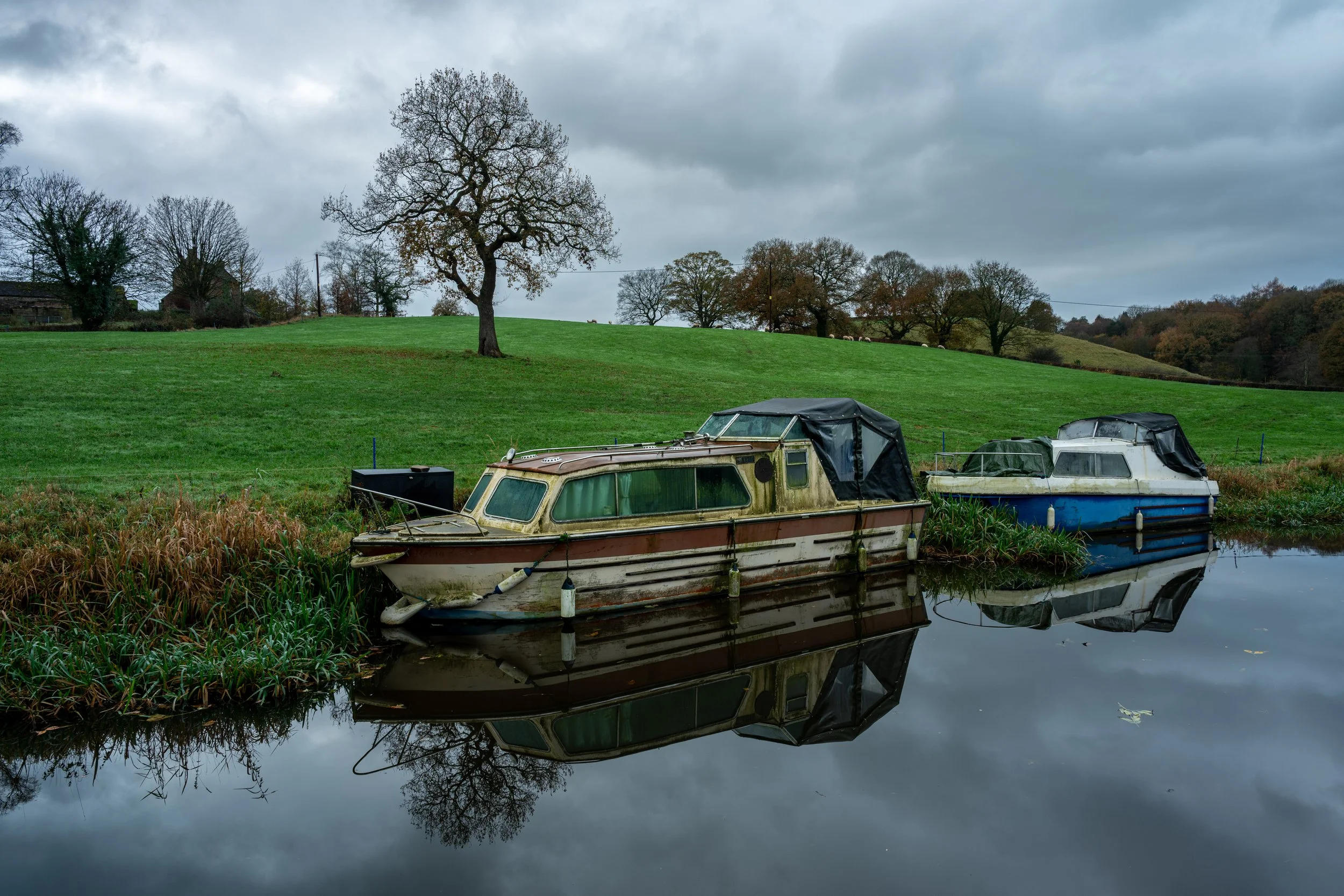 Moored canal boats at Denford on the Caldon canal