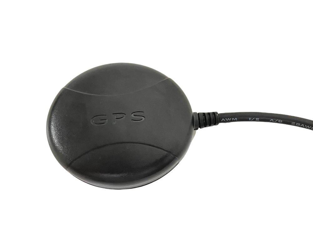 Black GPS device with a cable connected to it.