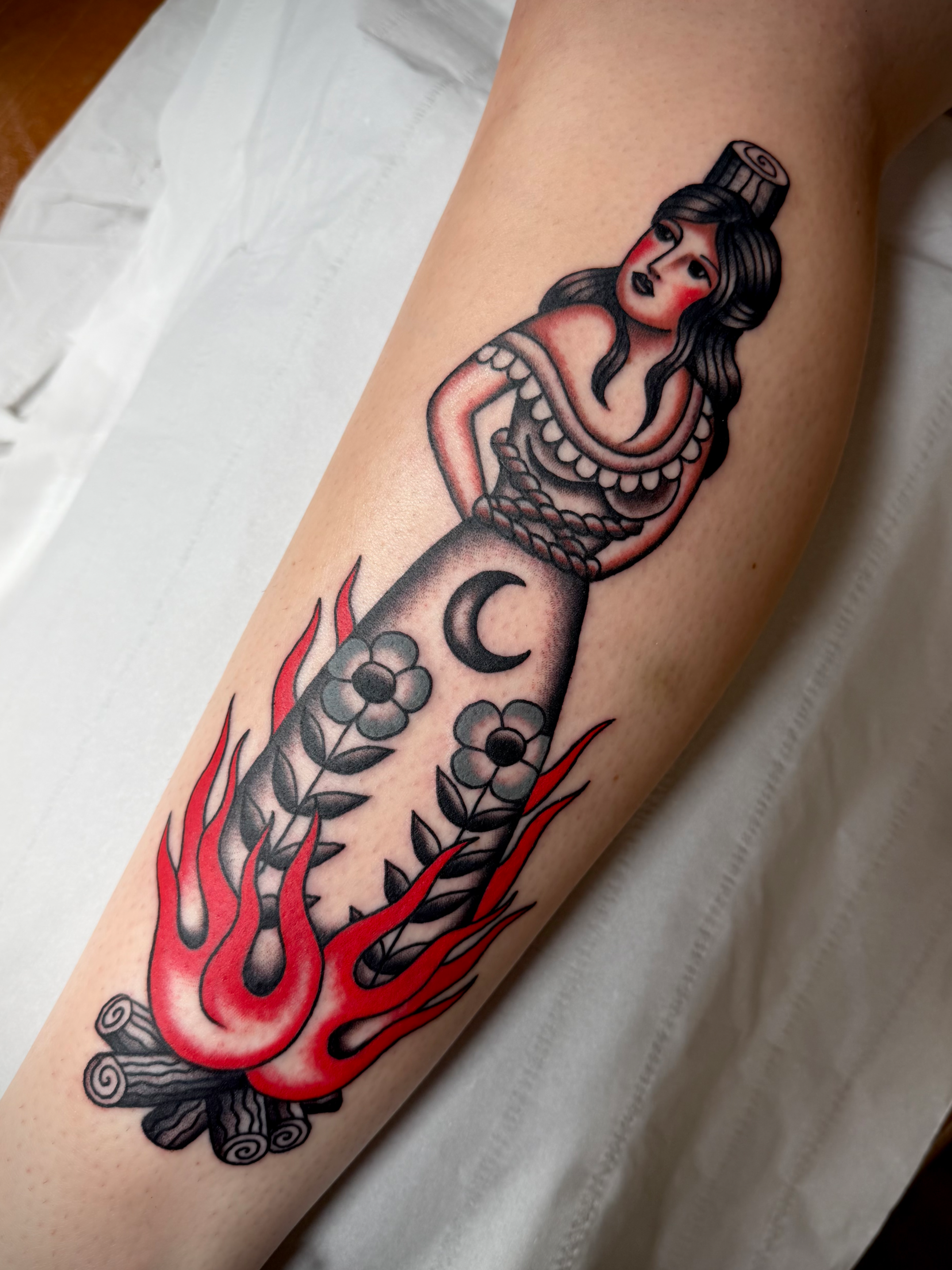Tattoo of a burning witch.