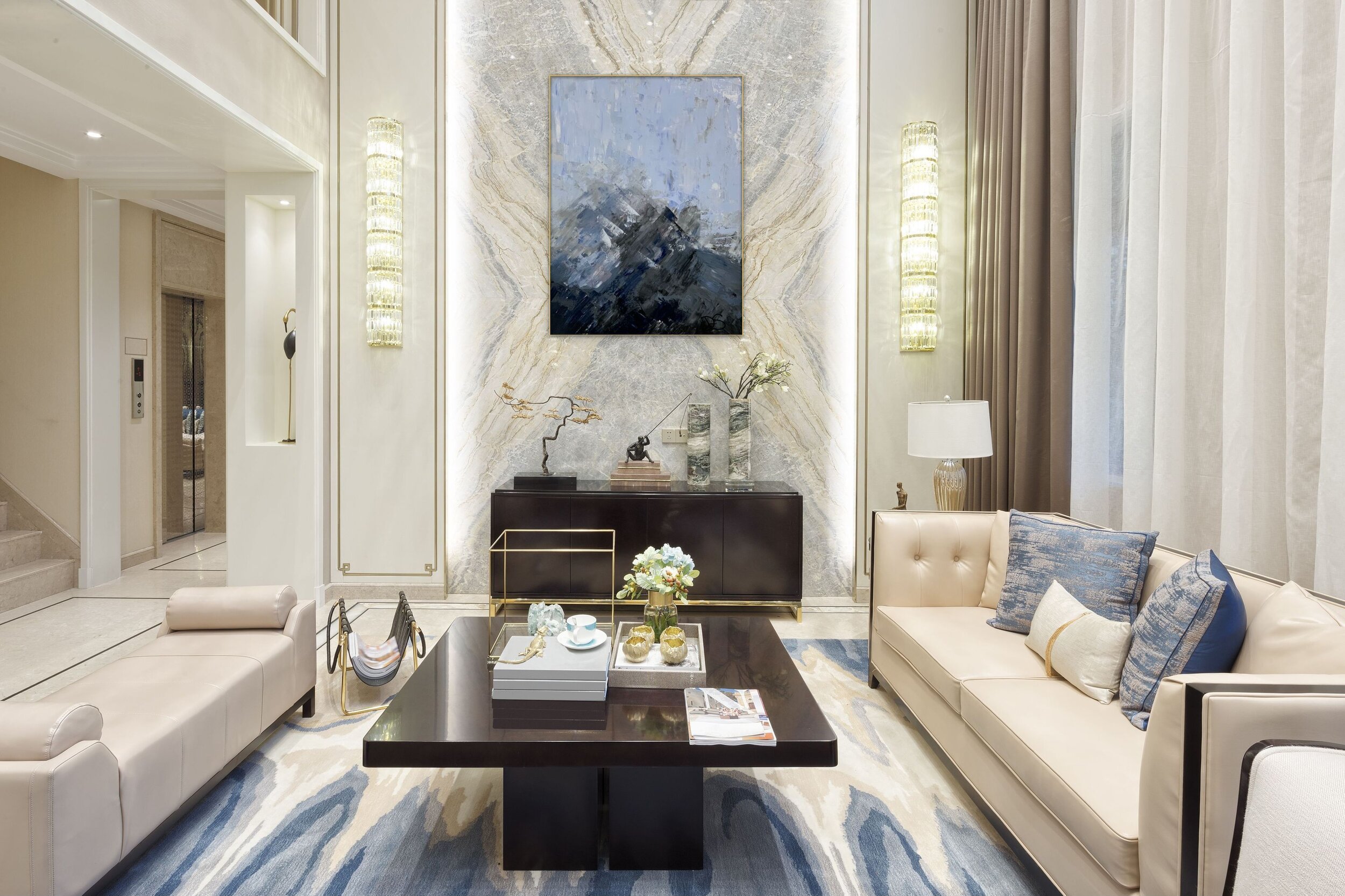 Blue, black, white abstract painting on hotel lobby wall.