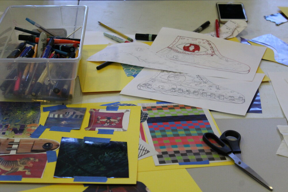  Collaging and moodboard materials including paper, tape, glue and scissors on a table. Credit: Mae Morris 