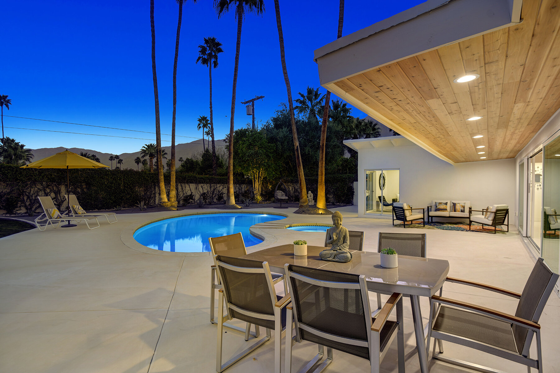 POOL SIDE DINING TO MOUNTAINS NIGHT MLS.jpg