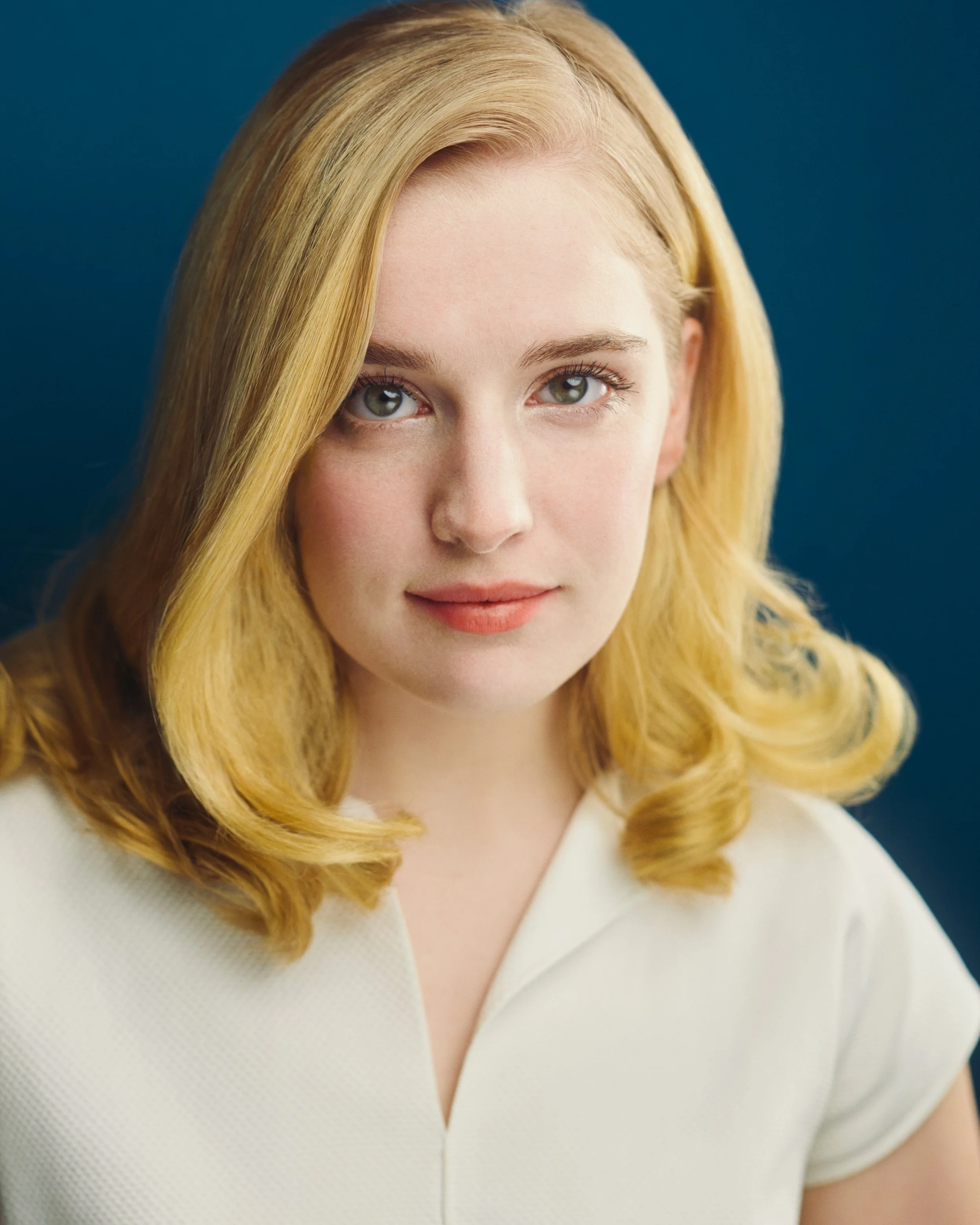 Colorful headshot of actress Elizabeth Harvard
