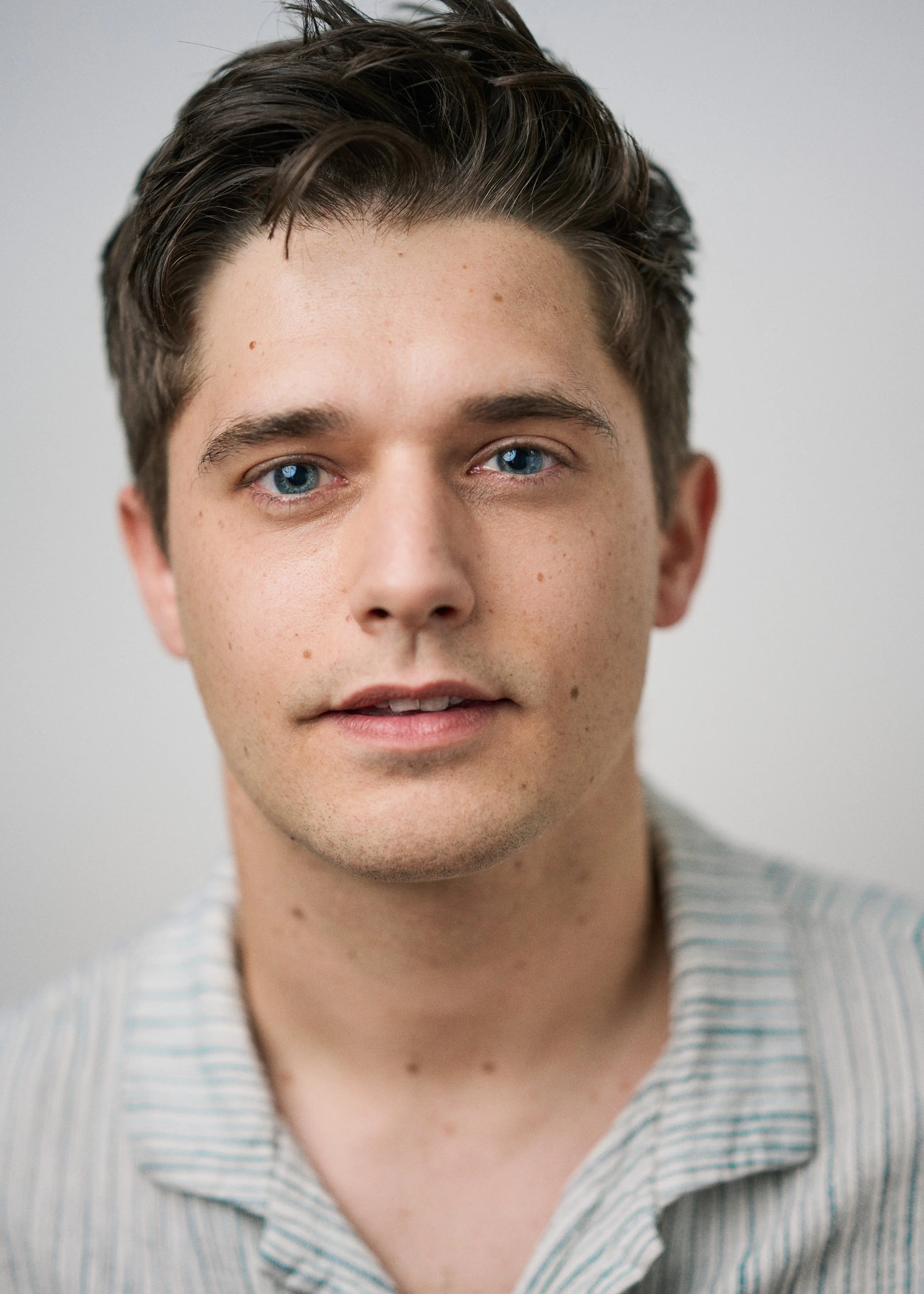 Soft light headshot of actor Andy Mientus