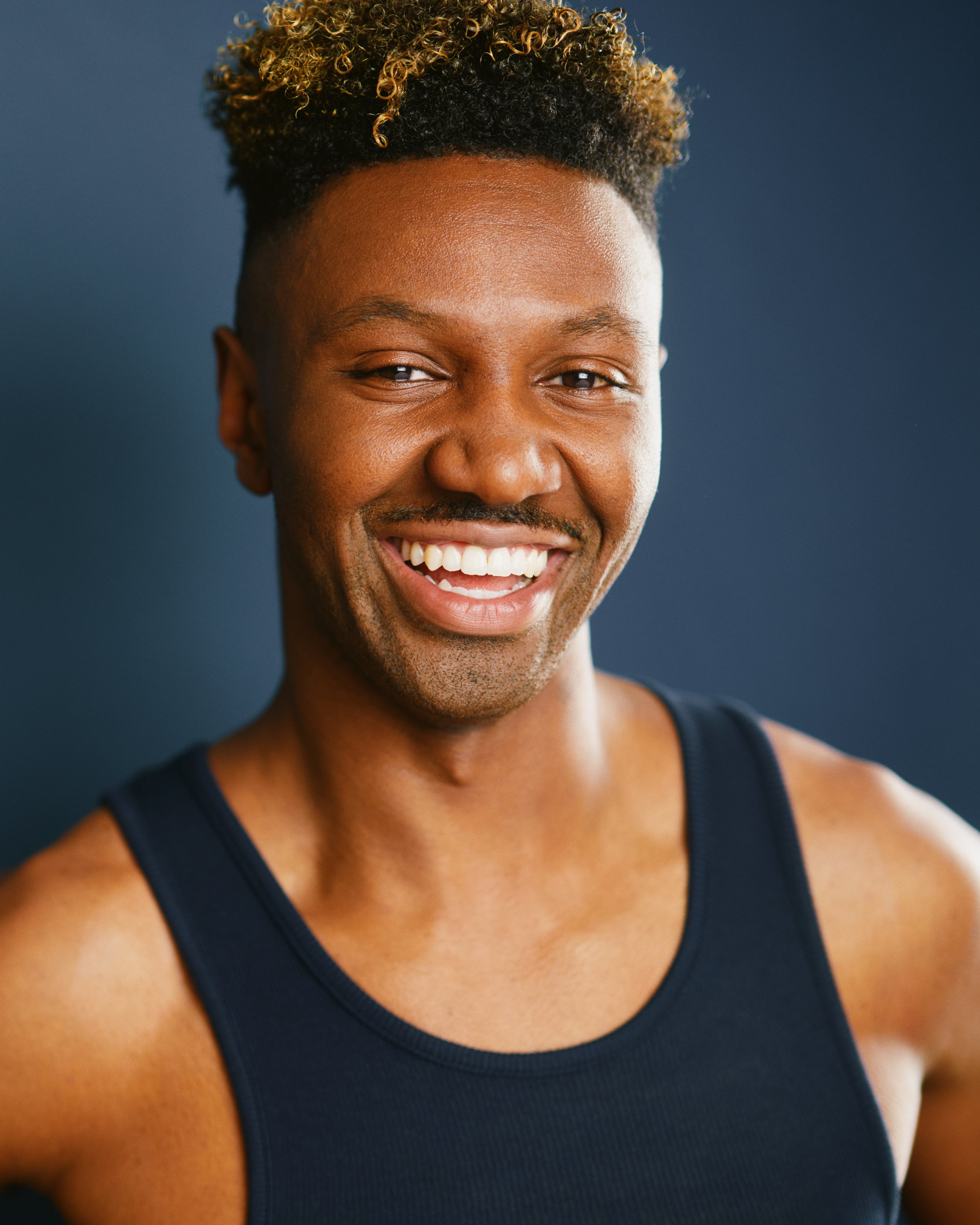 Vibrant headshot of actor Adam McDonald