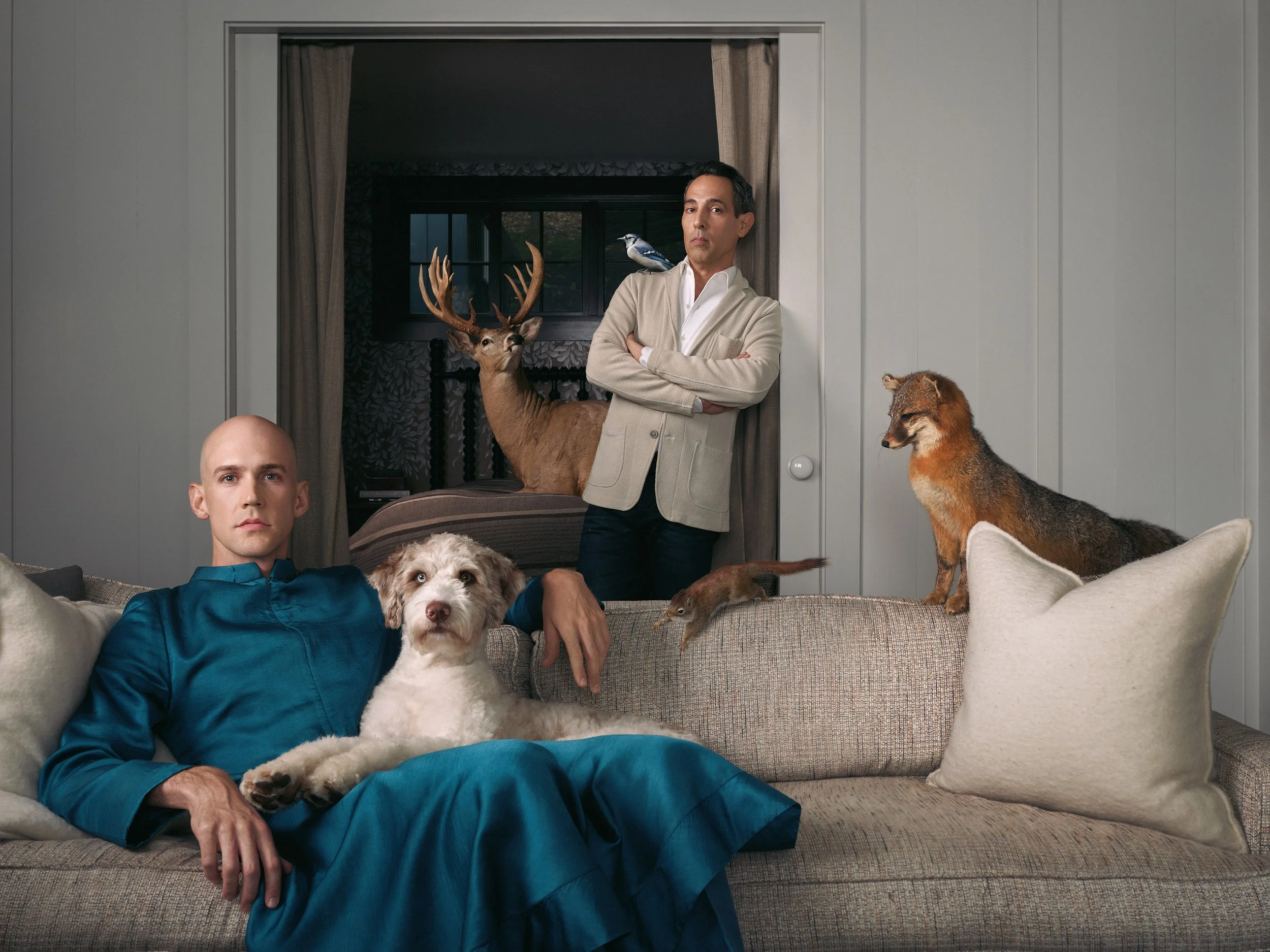 A surrealist painterly photograph of a couple surrounded by woodland creatures and their dog.