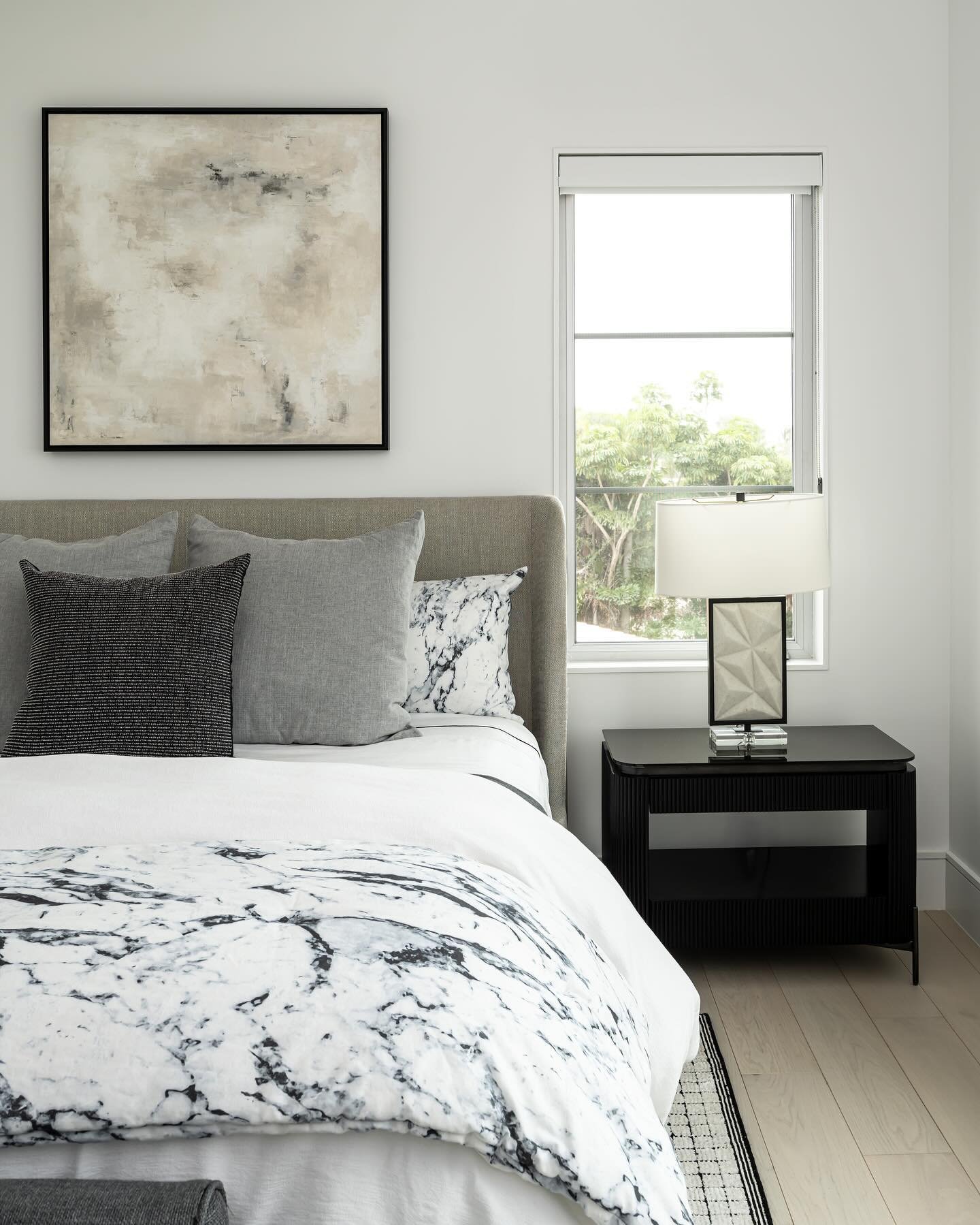 We created a serene and tranquil atmosphere in this bedroom by incorporating an array of soft and muted neutral shades, layered together to add depth and dimension. The addition of a subtle hint of blue adds a touch of coolness and calmness to the sp