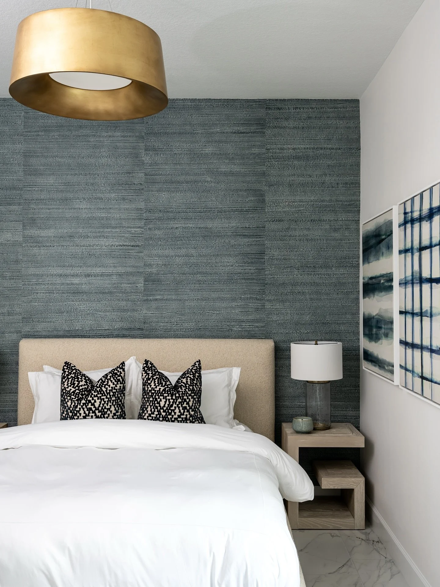 Sophisticated and serene &mdash; this space incorporates brass pendant lighting and indigo grasscloth wallcovering for a modern yet welcoming Guest Bedroom retreat.

Project: The Kaleidahaus 
Designer: @darbymichelle97 
Photographer: @thelaurahenry 
