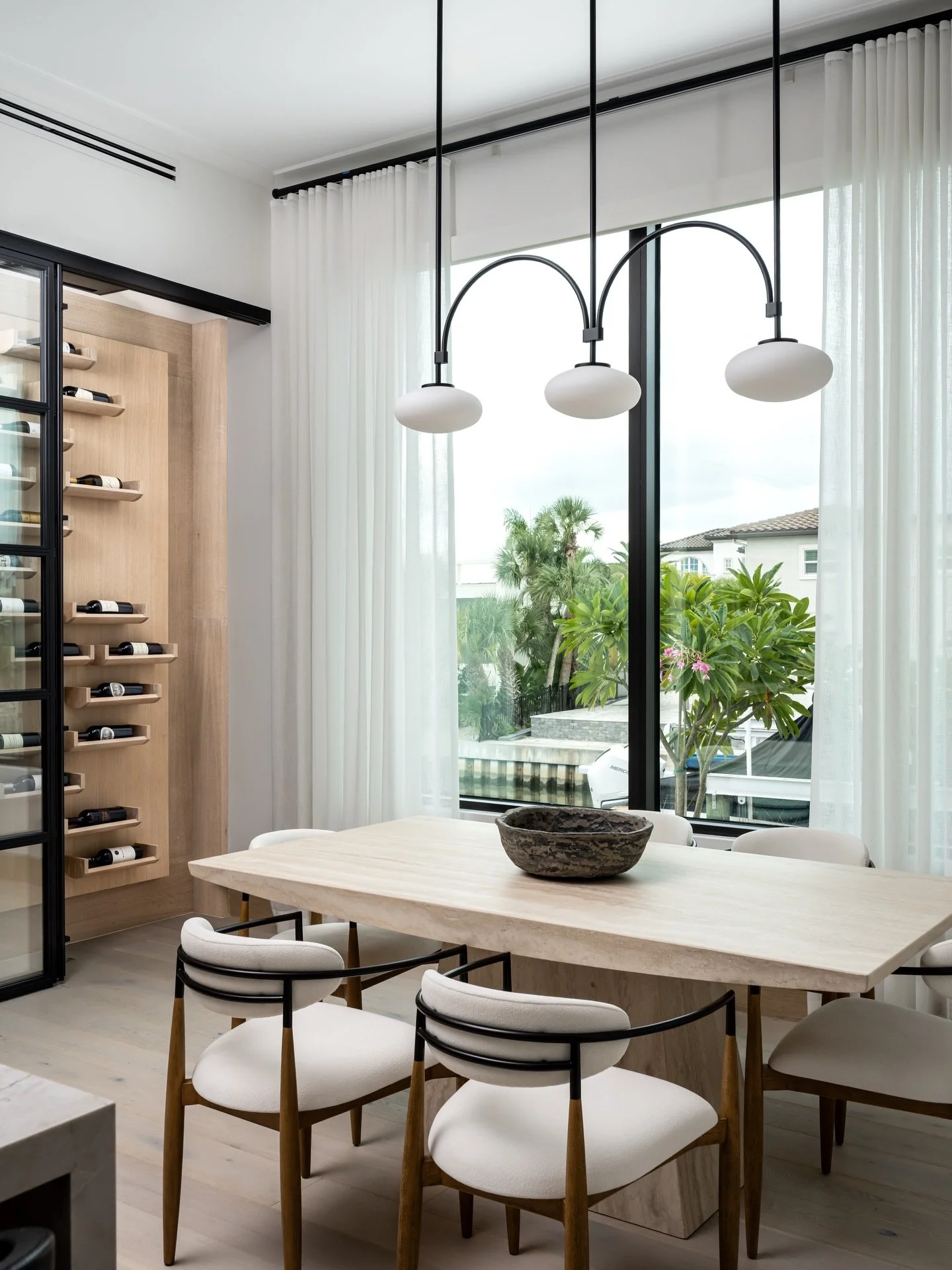Understated elegance meets everyday living in a dining space designed for gathering. A custom wine wall and soft, layered finishes create a refined yet inviting atmosphere in this Longboat Key residence.

Project: Halyard
Designer: @chloeweatherford 