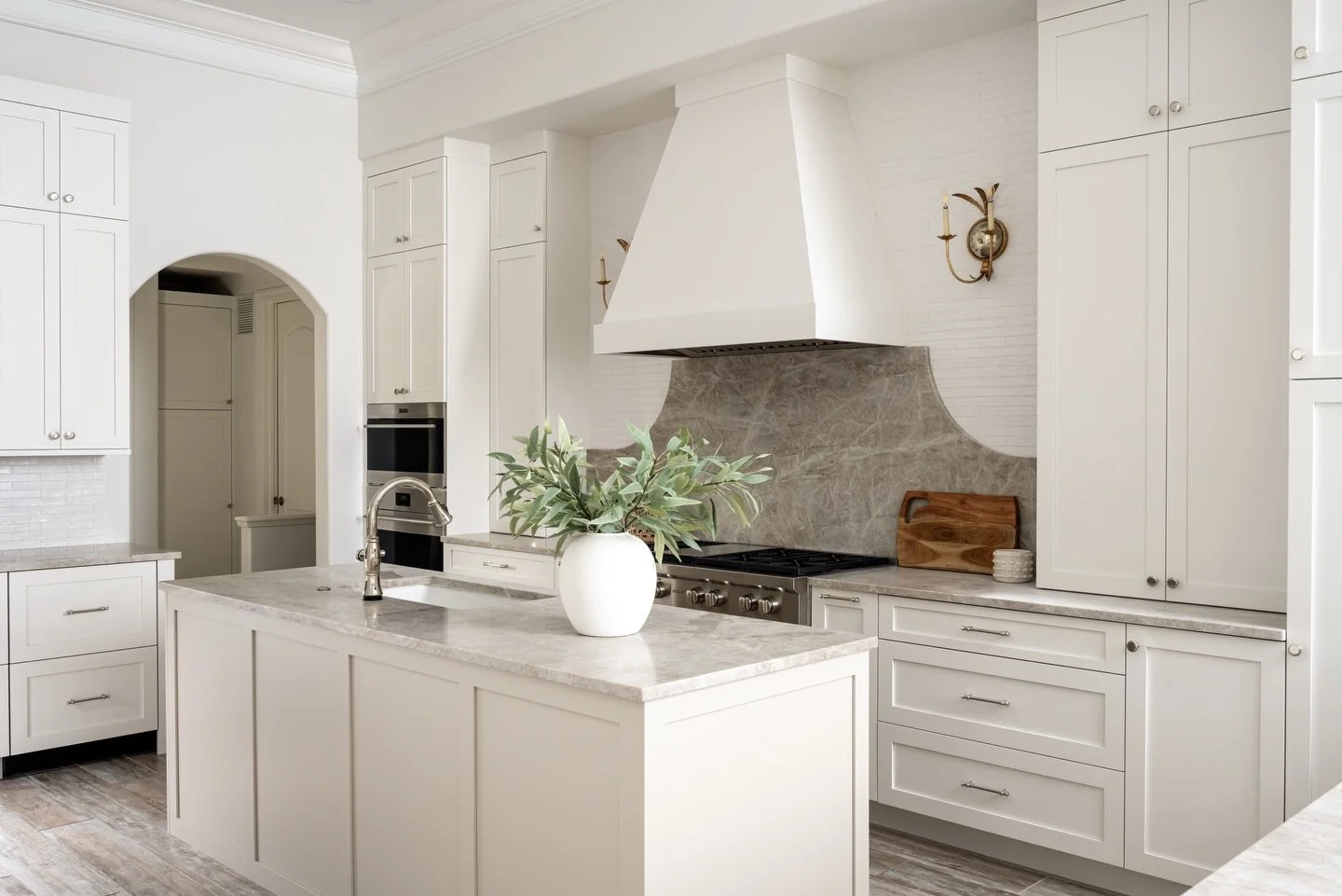This project is a refined expression of timeless design, where thoughtful details and layered textures come together to create a home that feels both elevated and inviting. At the heart of the transformation is a fully reimagined kitchen, featuring T