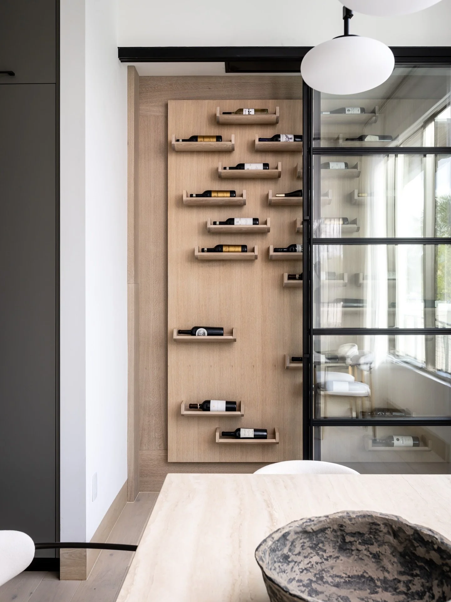 Designed to be both functional and sculptural, this custom wine wall transforms a collection into a statement piece. Warm white oak, clean lines, and steel-framed glass create a seamless blend of modern elegance and everyday living. 🍷

Project: Haly
