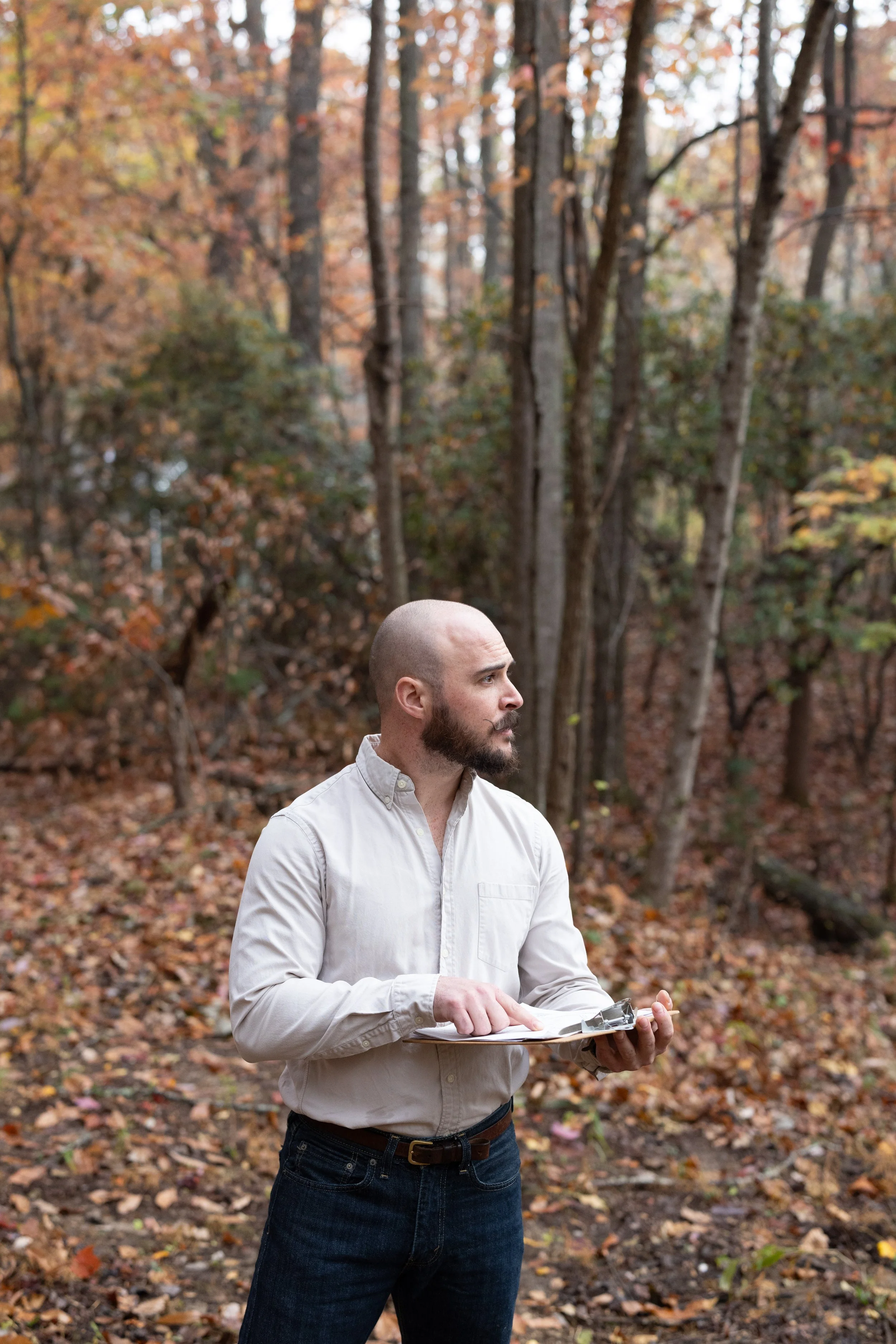 Luke Costlow reviewing site observations during a permaculture coaching consultation in Western North Carolina