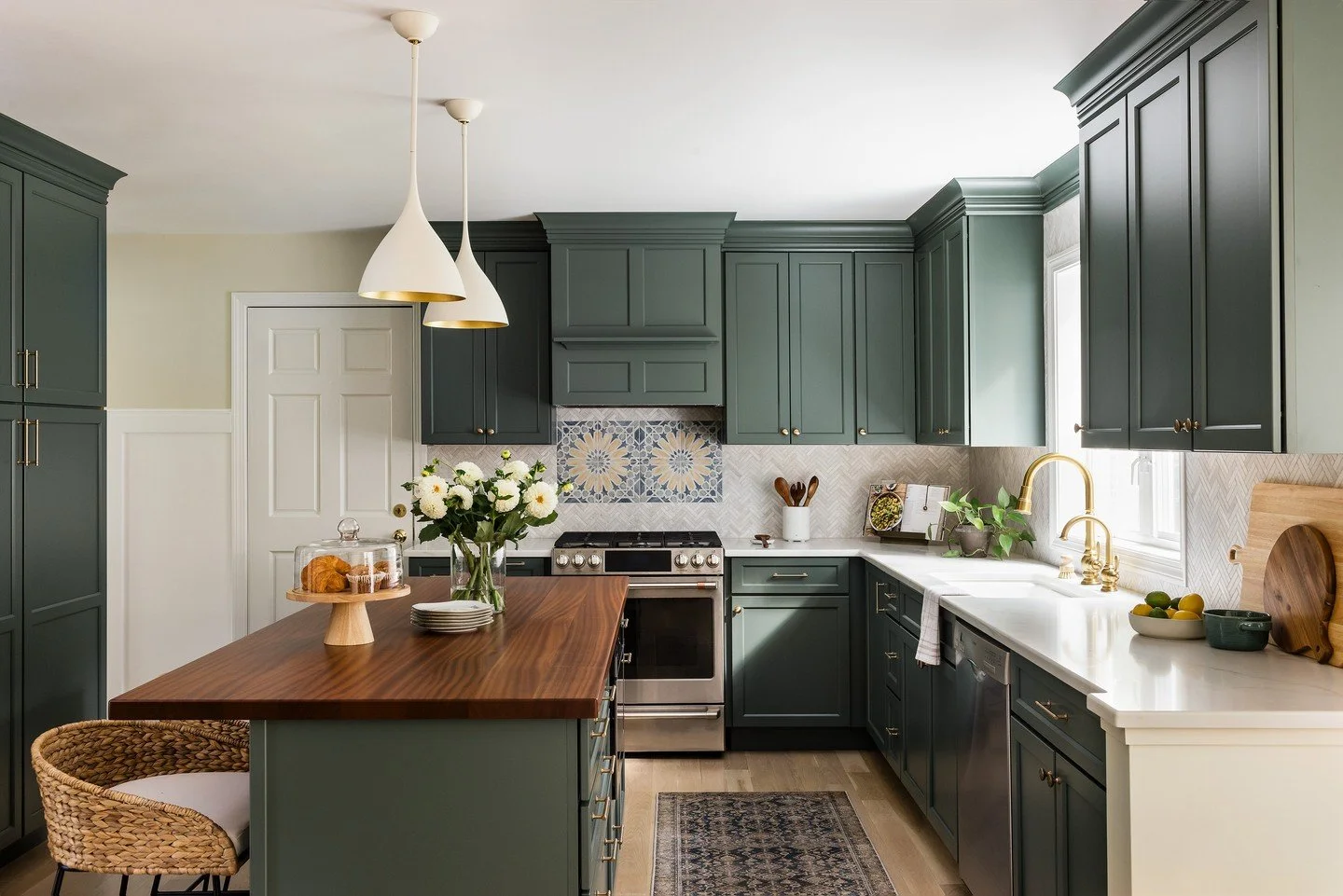 The Olive Hollow kitchen renovation began with a structural decision: opening the wall to widen the connection to the adjacent breakfast area, creating a flow that extends naturally into the living room. A wet bar was added at that transition &mdash;