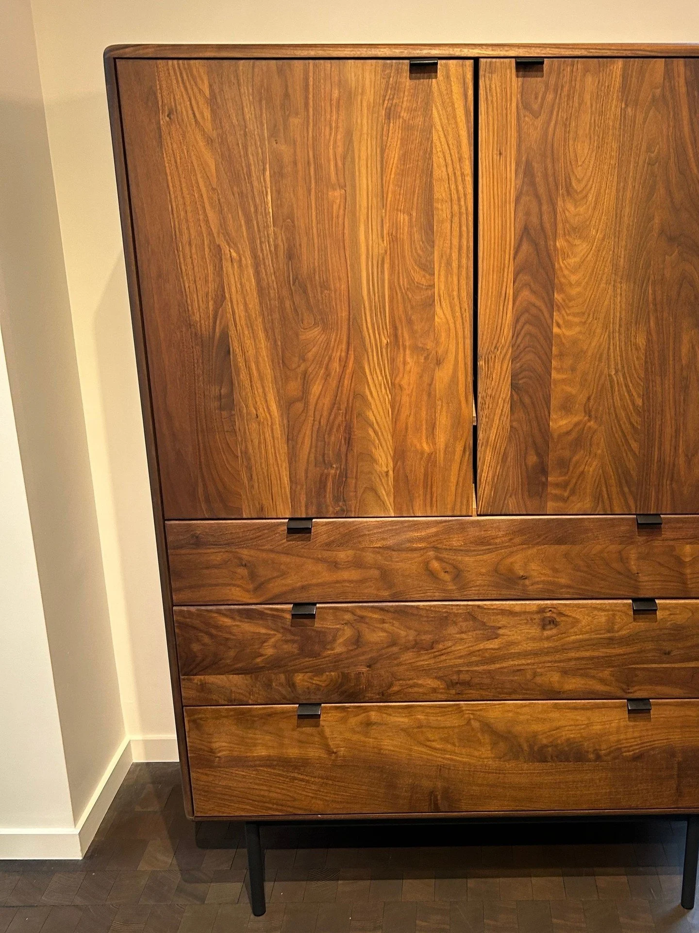 Furniture installation day always brings a project one step closer to feeling like home.⁠
⁠
This storage piece immediately caught our attention for its beautiful walnut grain, clean lines, and thoughtful craftsmanship. Pieces like this work hard behi